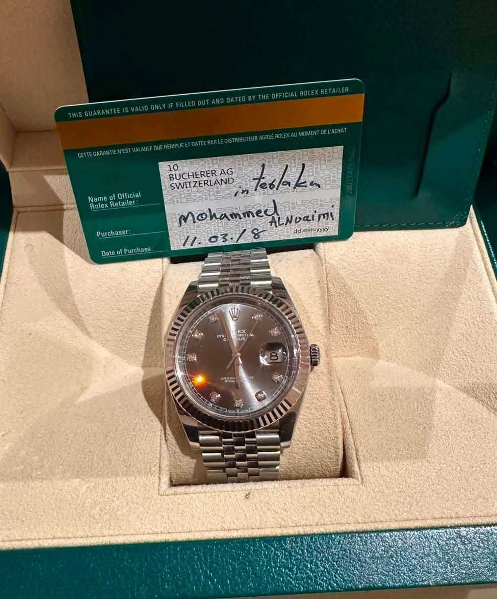 May be an image of wrist watch and text that says 'IALROLEXRETAILER Nam Official Rolex Retaver Purchaser: BUCHERERA AG SWITZERLAND teslaka MohammesAerbaimi ddmitayyYy Mohammed.…