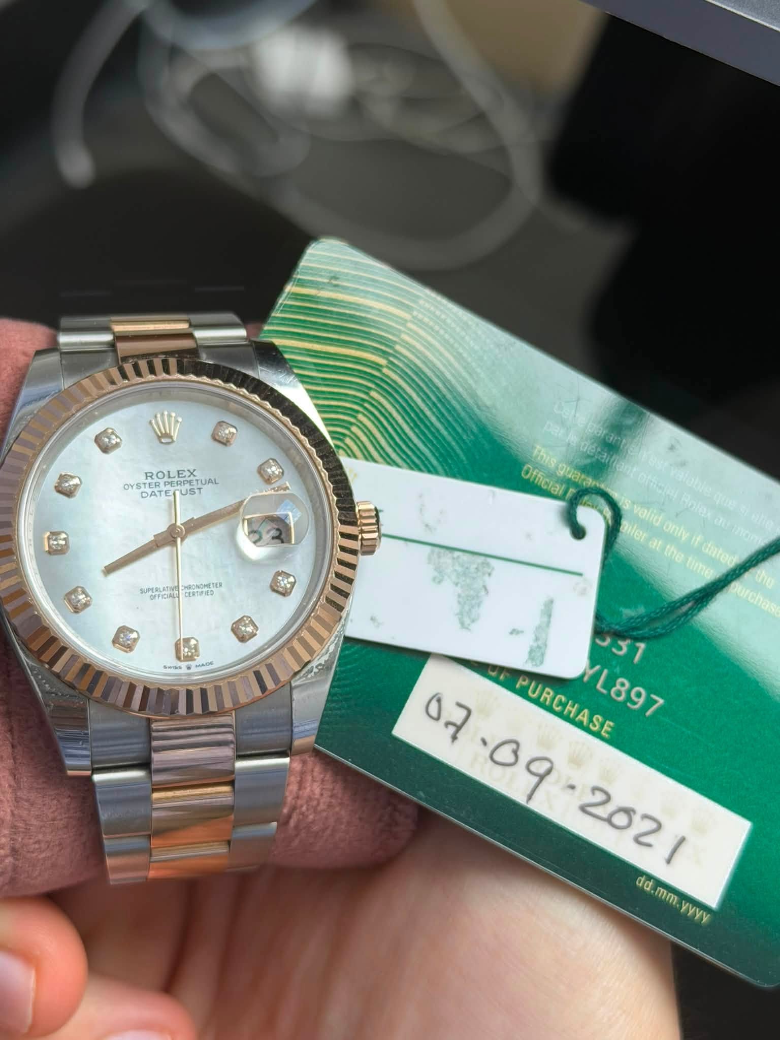 May be an image of wrist watch and text