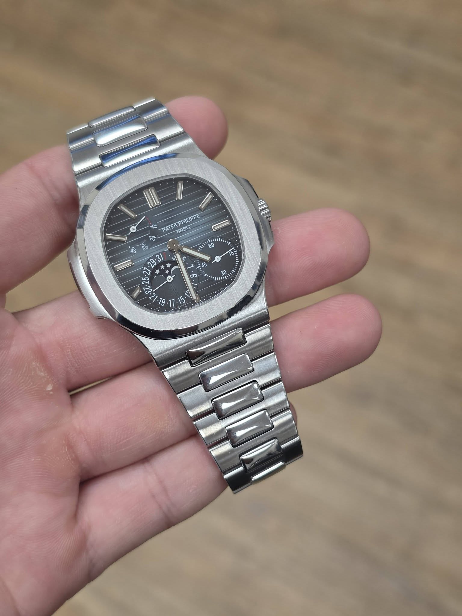 May be an image of wrist watch and text