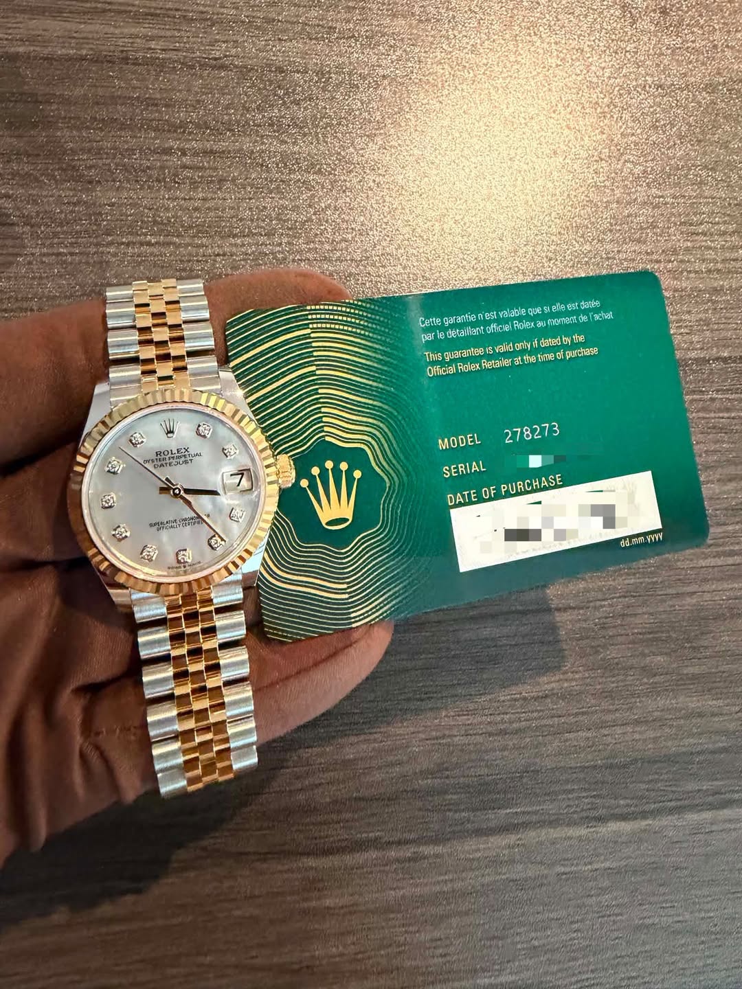 May be an image of wrist watch and text