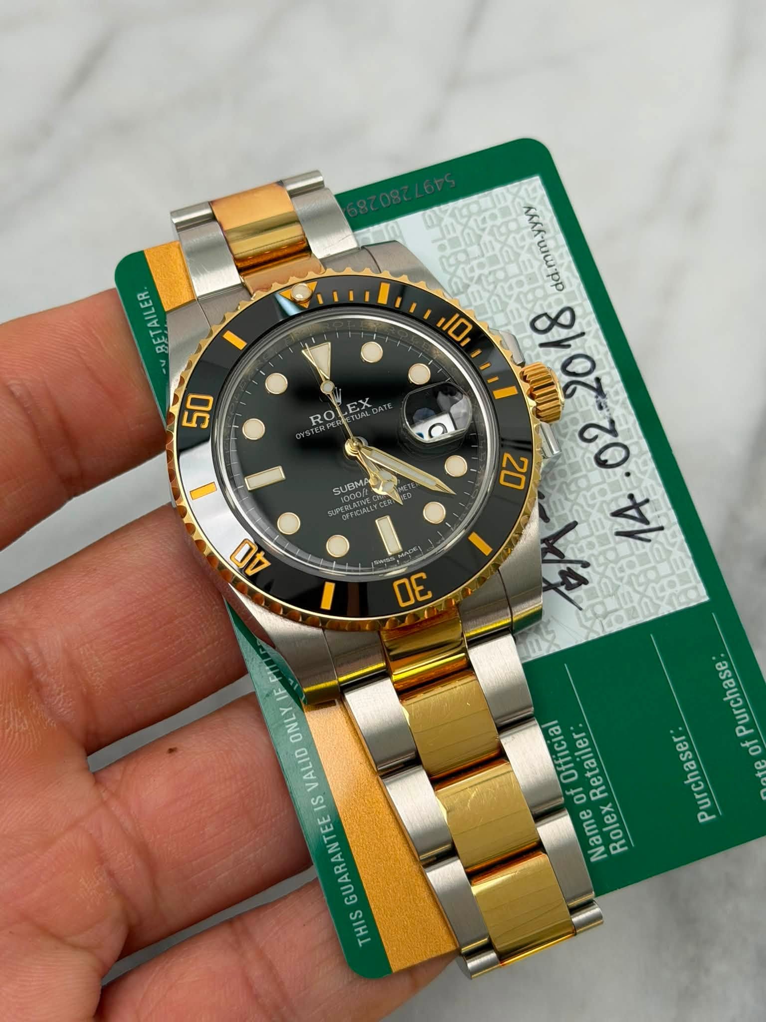 May be an image of wrist watch and text that says 'BETAILER IO, 50 ROLEX RO d.mm-yyyy mm yyyy 0U0 8 8108 A 20 20 ሁዙ C SUBIMA 40 1 30 F1 Purchase Purchaser of Official of Retailer:…