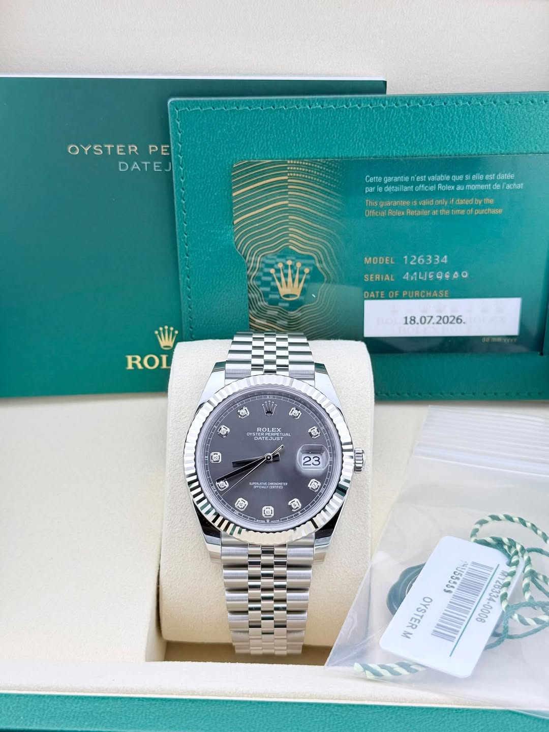 May be an image of wrist watch and text