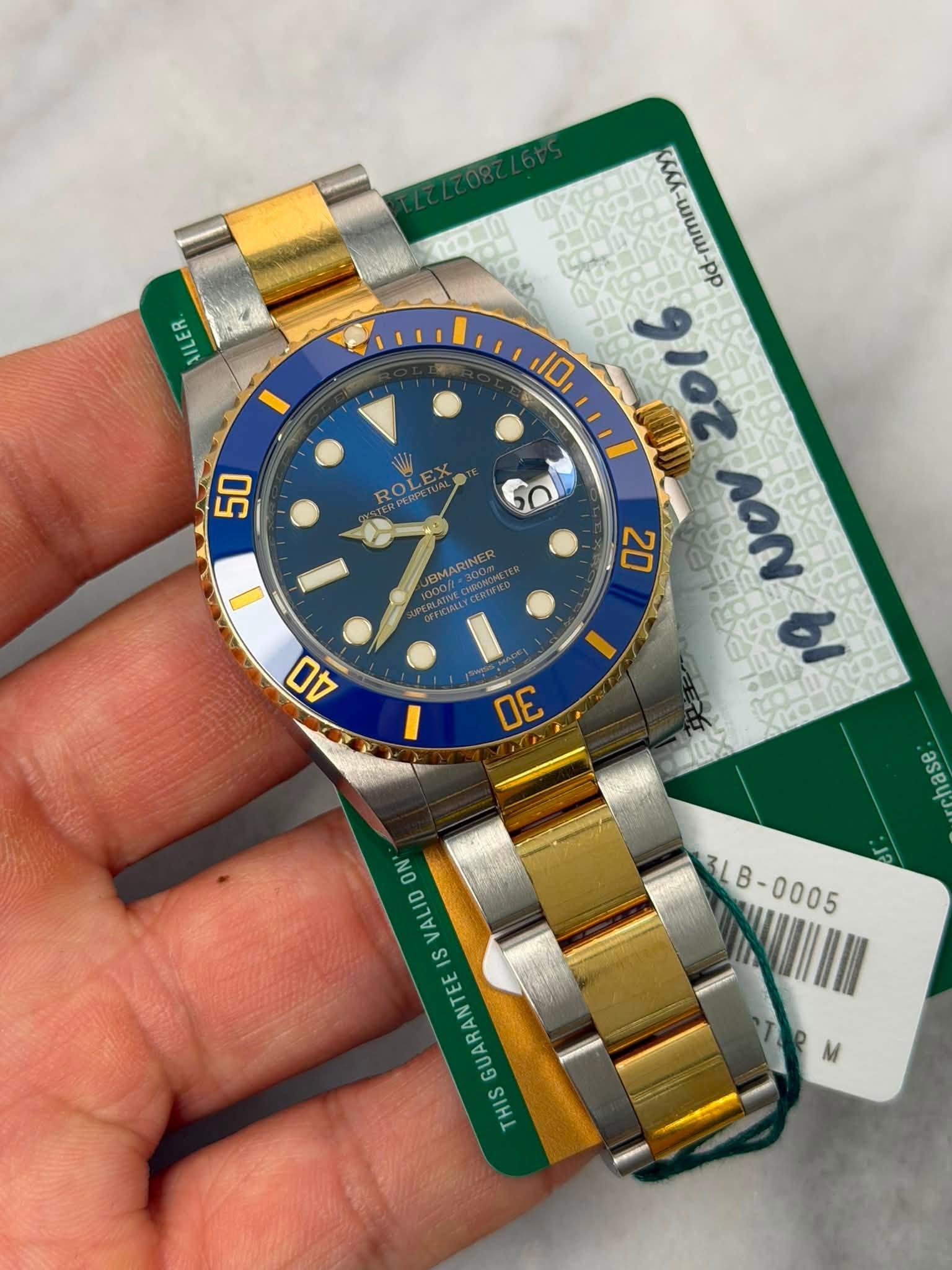 May be an image of wrist watch and text that says 'En 남크기% 50 ROMT dd-mmm-yyy dd-mmmm 10, 910z 20 ΛΟΝ bI BMARINER 40 I DE asa 3LB- ON VALID S IS GUARANTEE THIS'