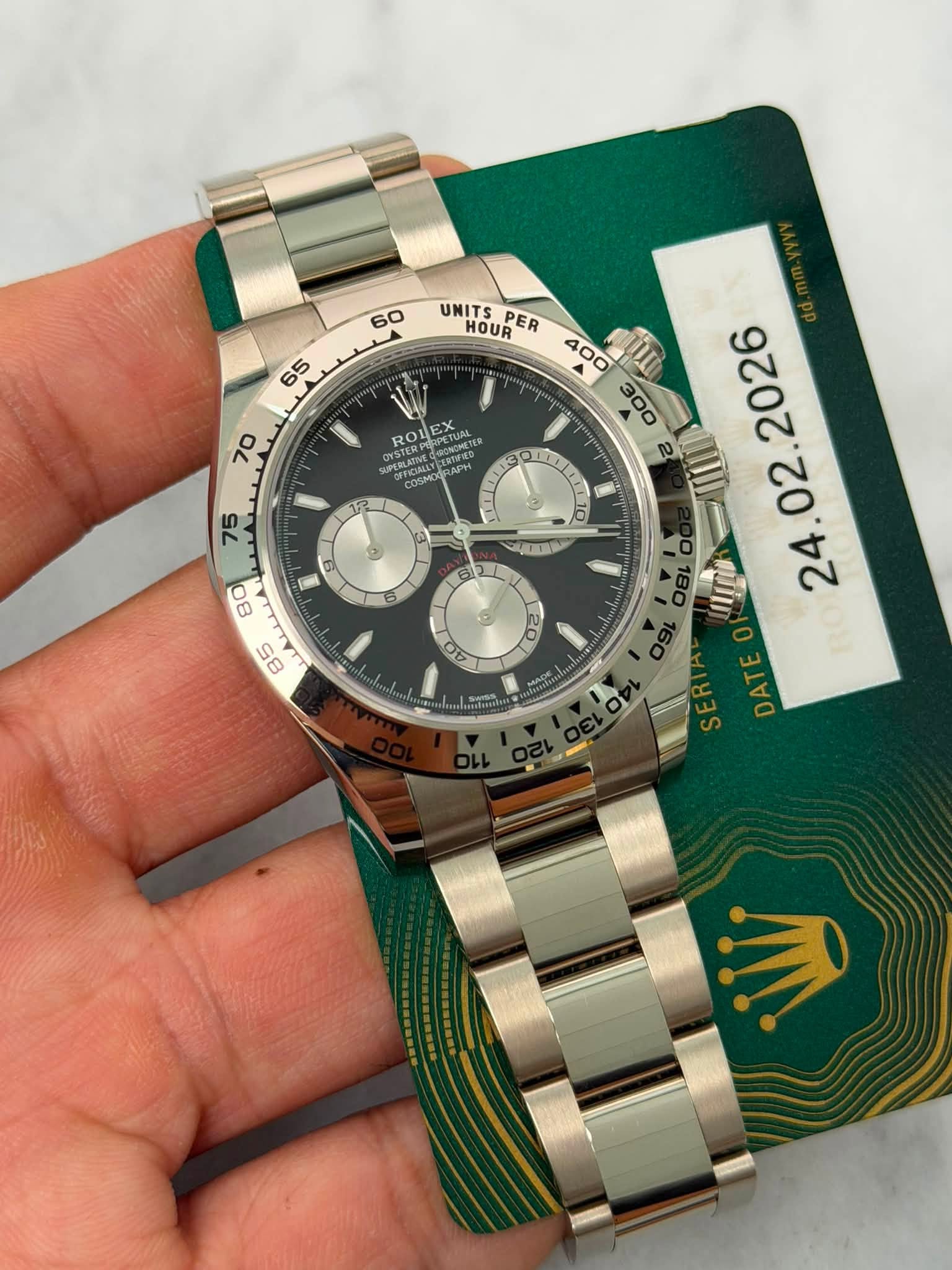 May be an image of wrist watch and text