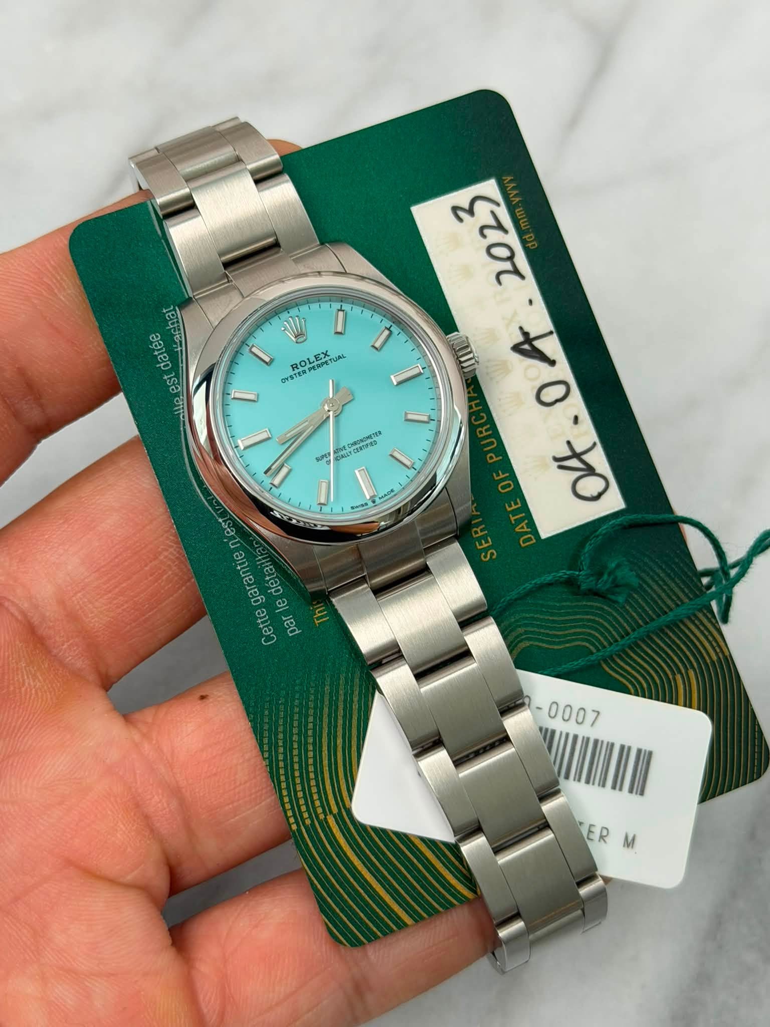 May be an image of wrist watch and text