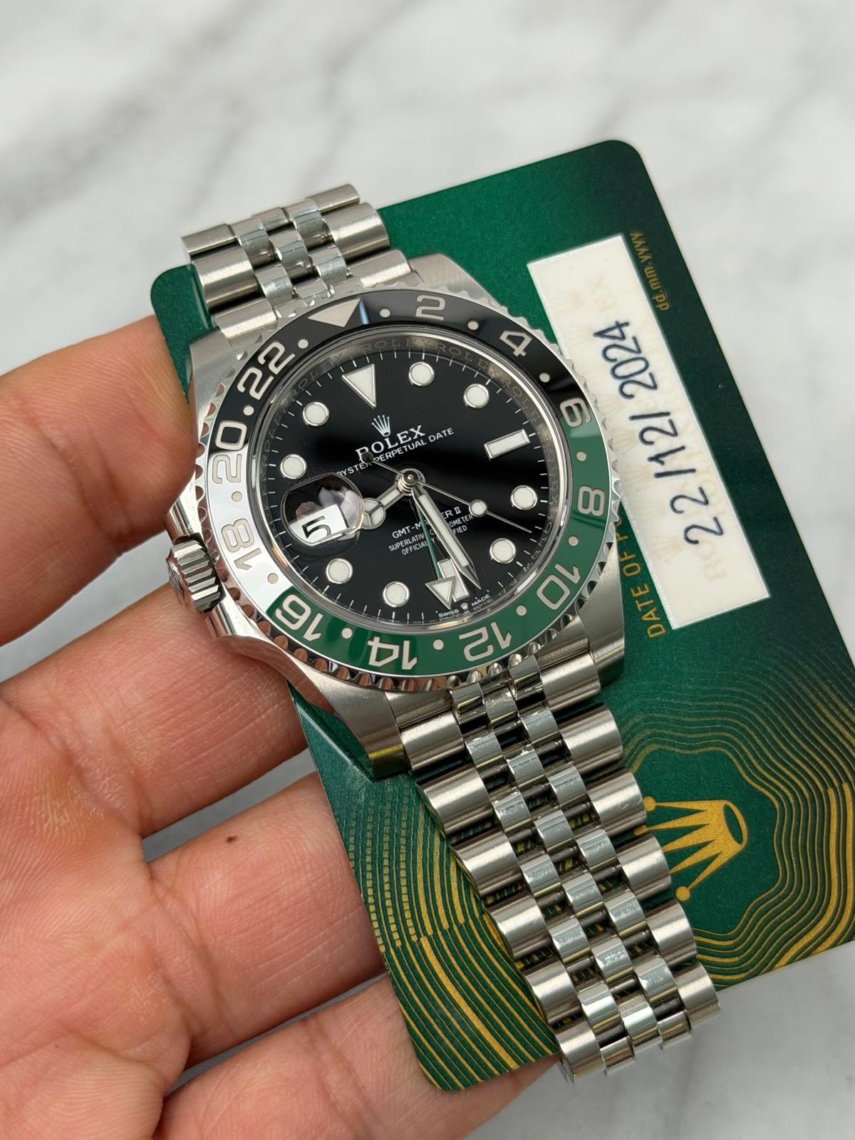 May be an image of wrist watch and text