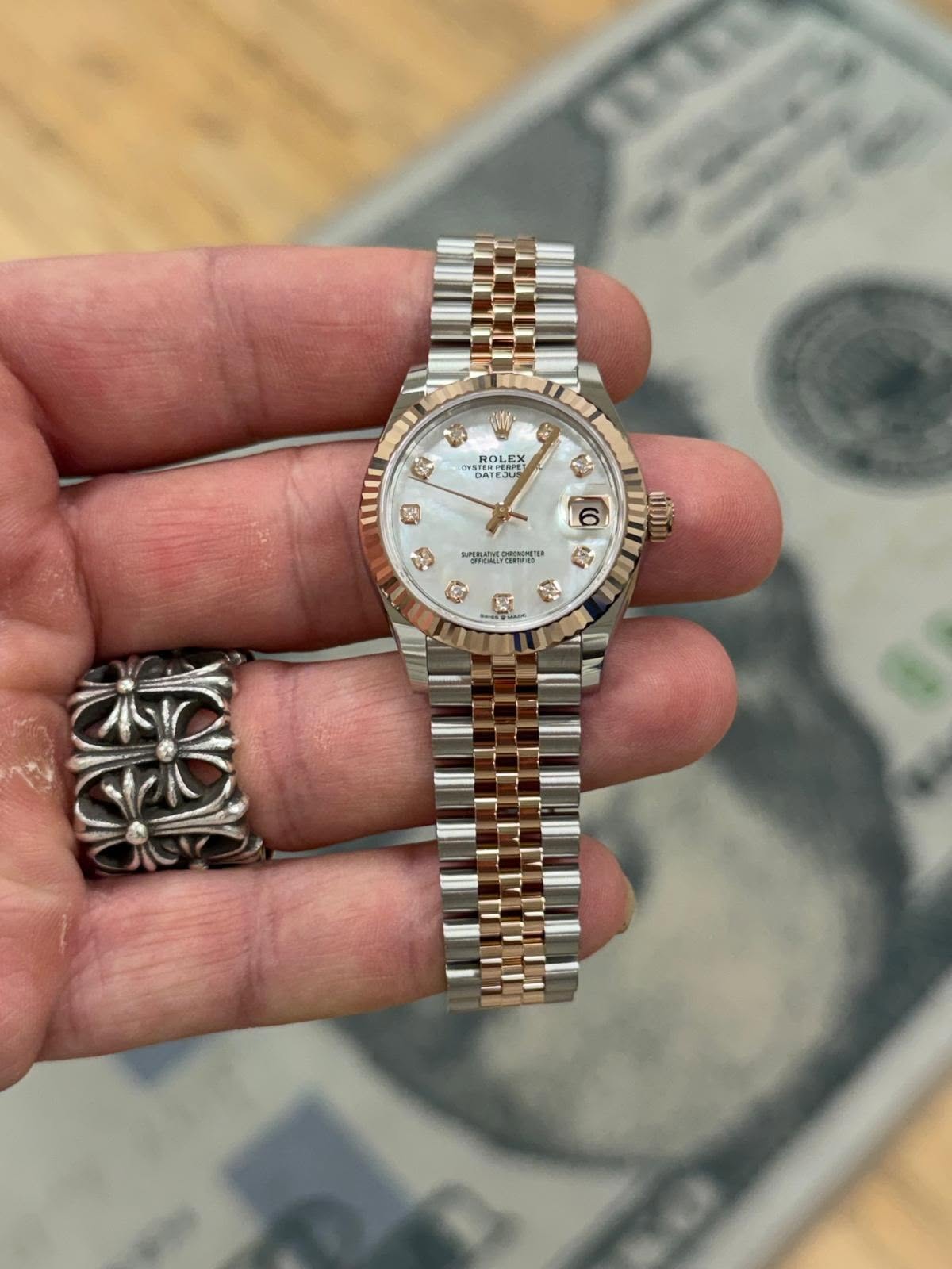 May be an image of wrist watch and text