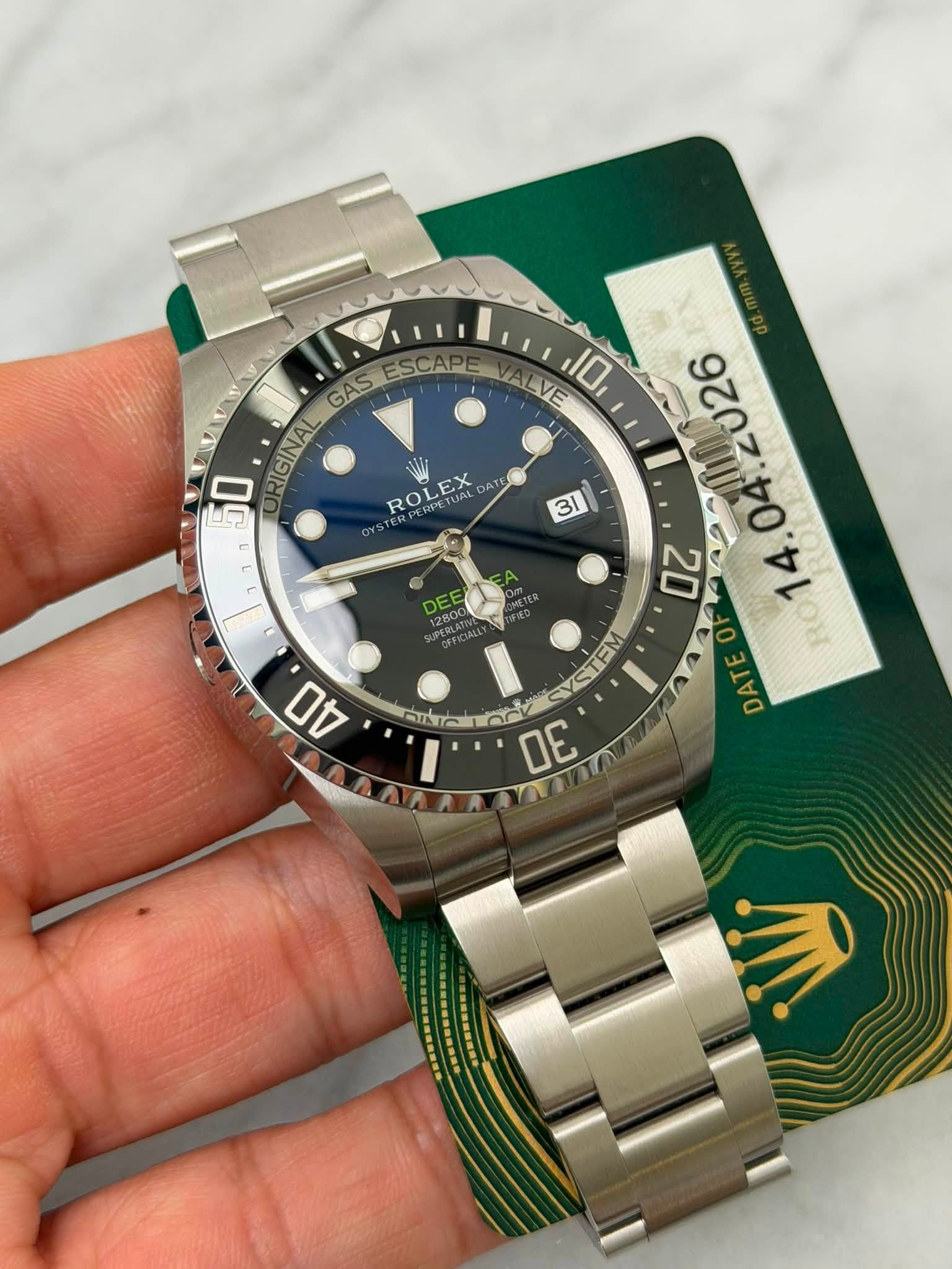 May be an image of wrist watch and text