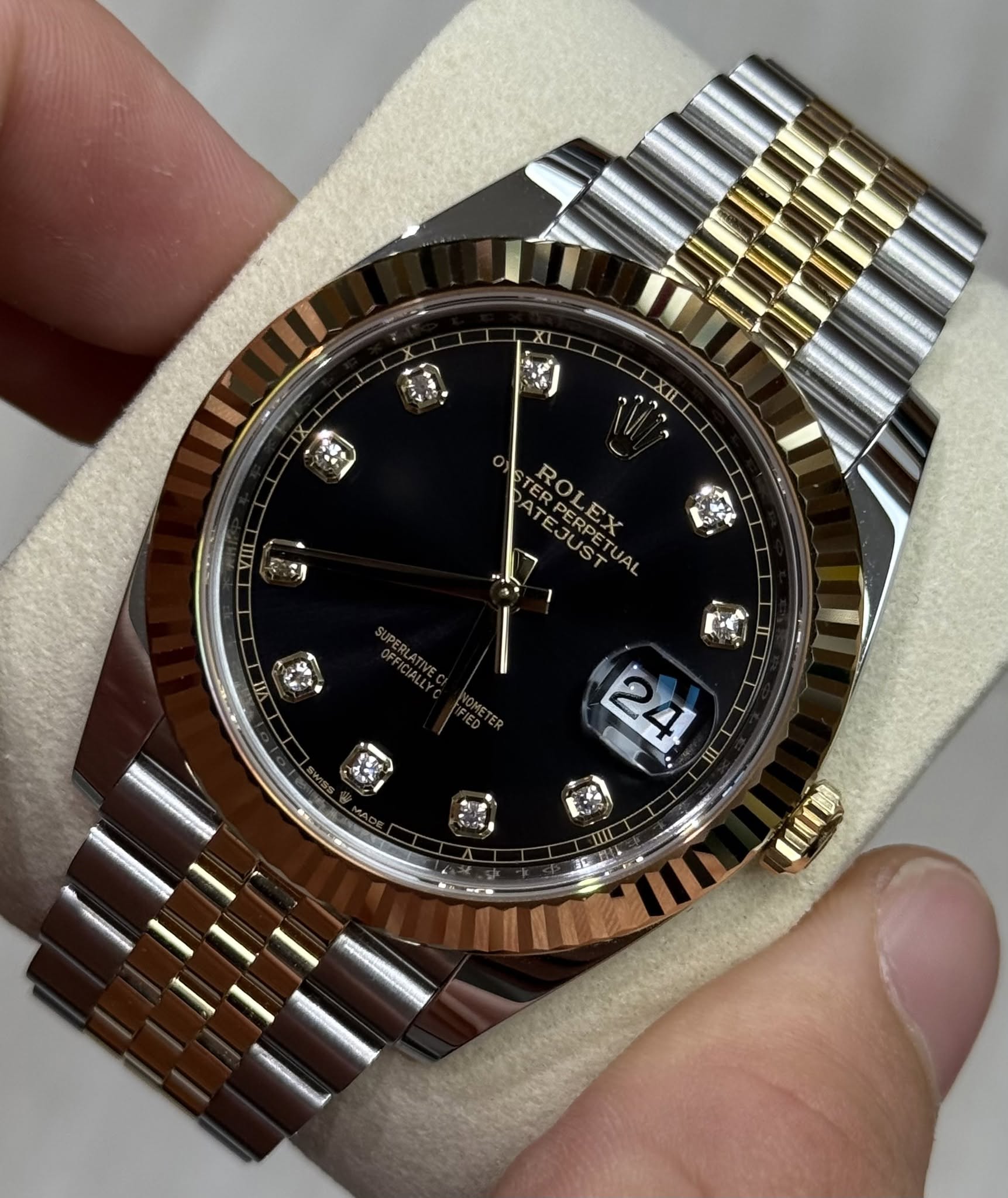 May be an image of wrist watch and text