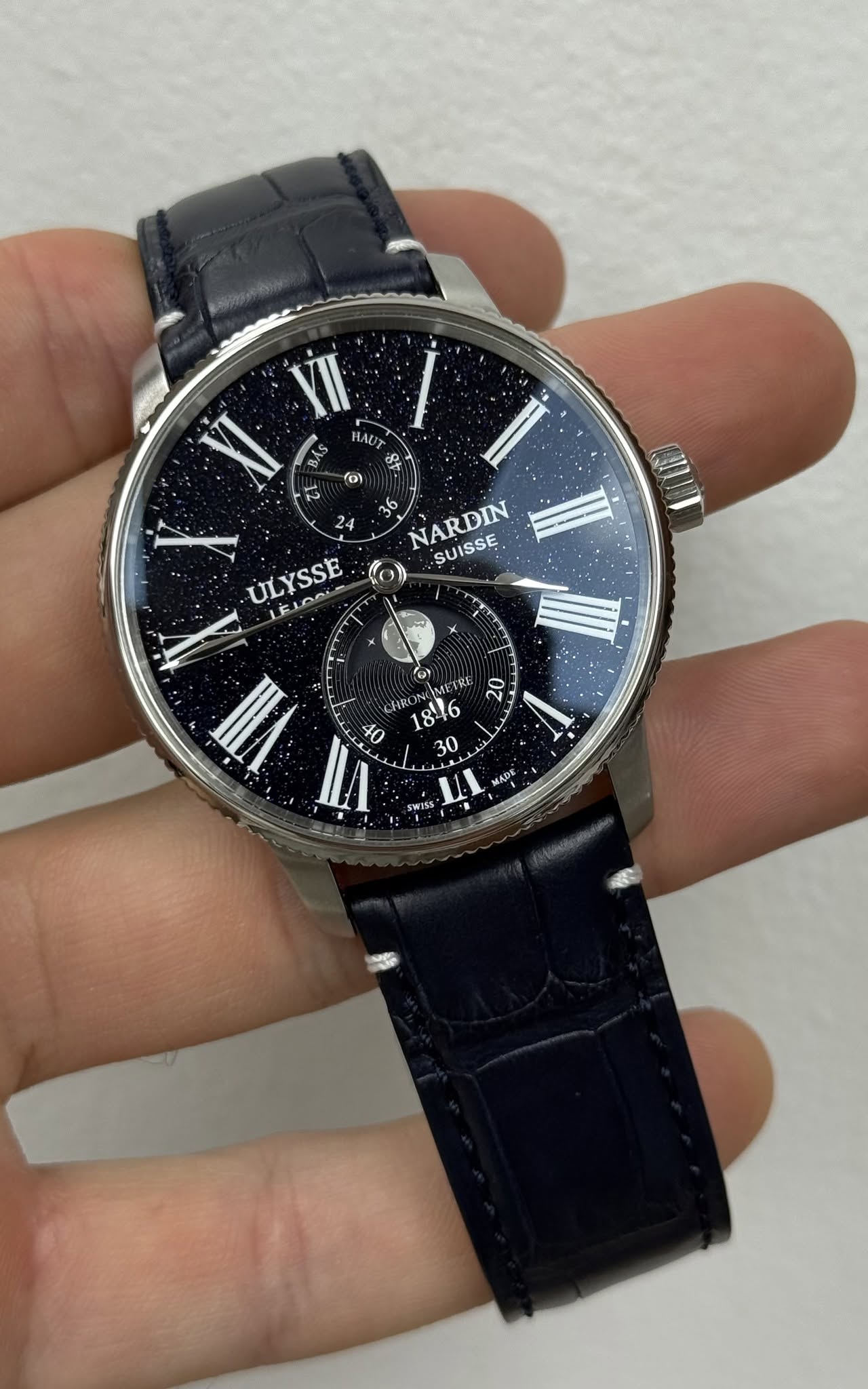 May be an image of wrist watch and text that says 'YII BÁS HAUT 8 2 fo) 24 NARDIN. SUISSE ULYSSE KON LELOO ИИ ق IMFI ETRU 2 V cИBoжR: HRO ر ADE המוה イ'