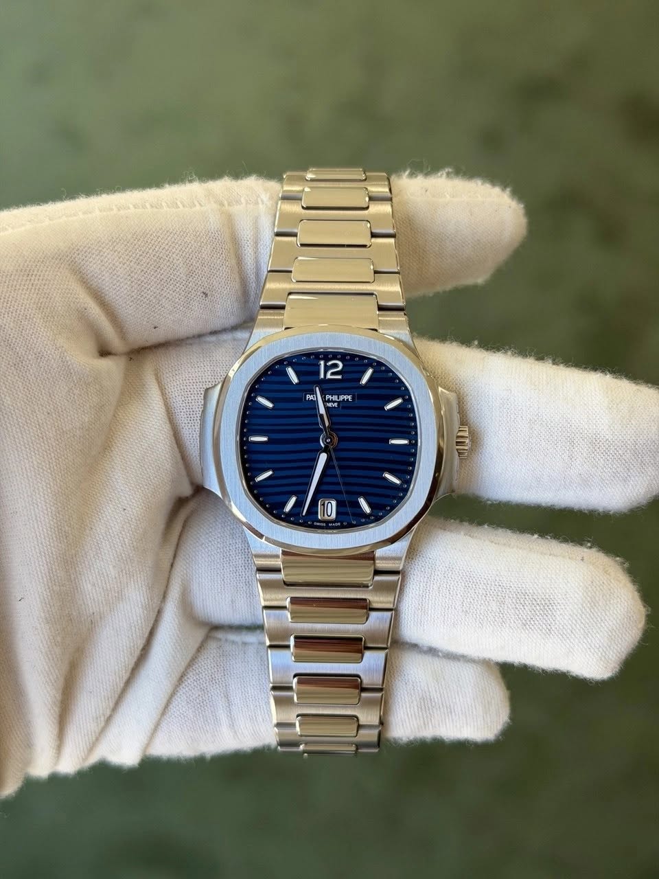 May be an image of wrist watch and text