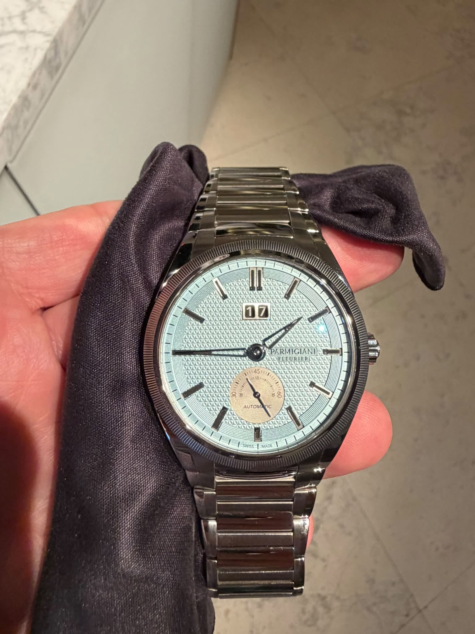 May be an image of wrist watch and text