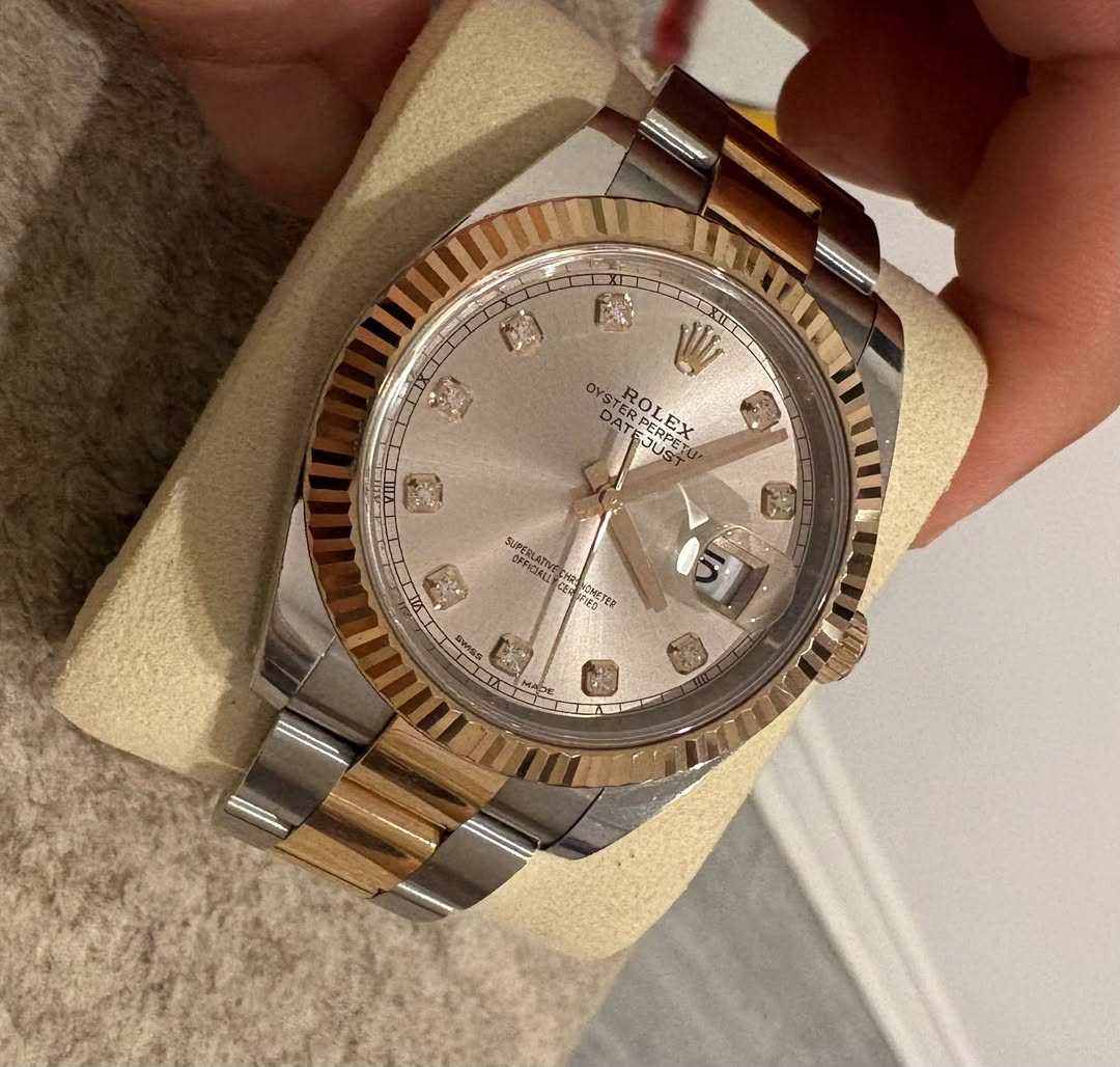 May be an image of wrist watch and text