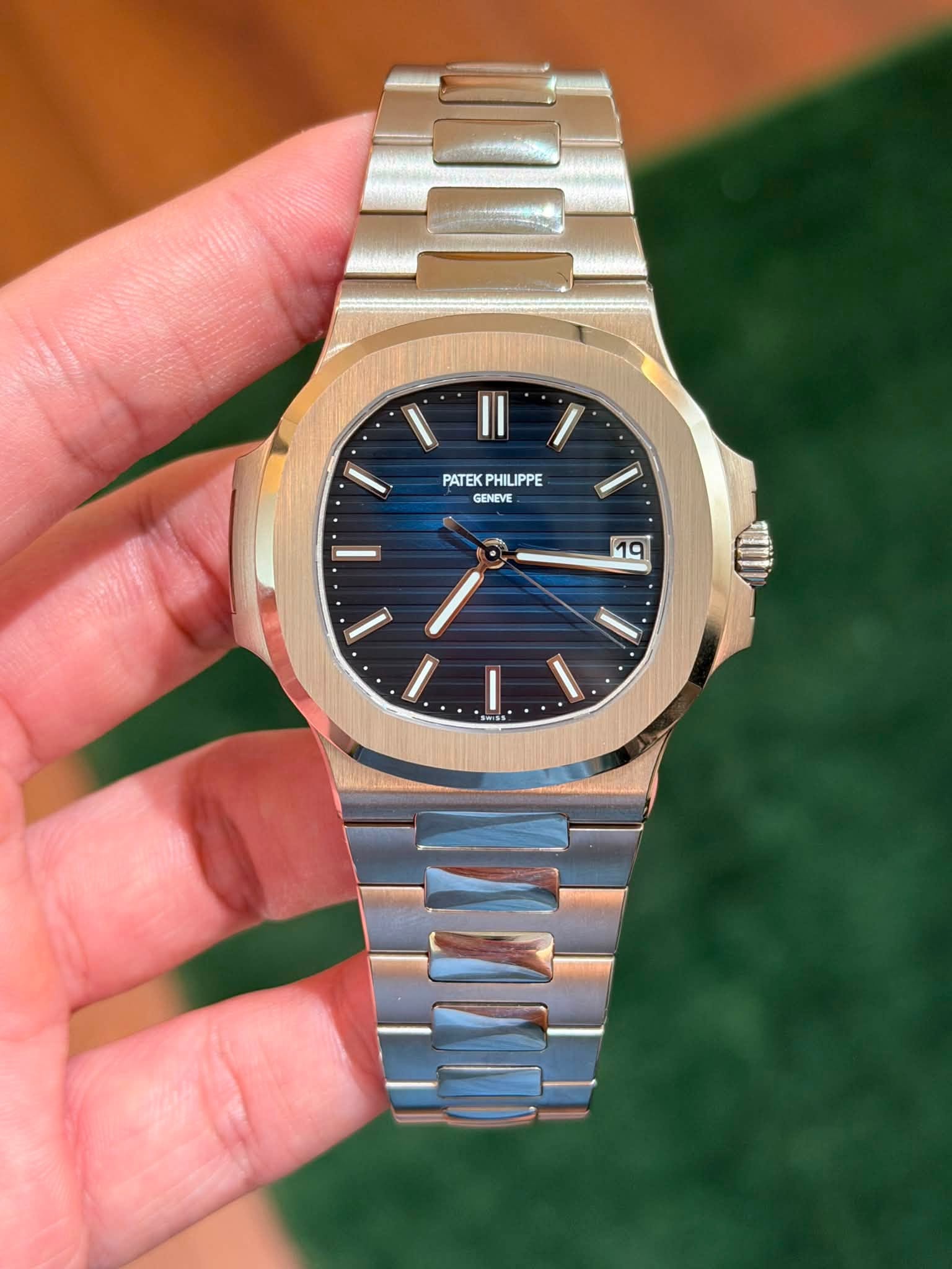 May be an image of wrist watch and text