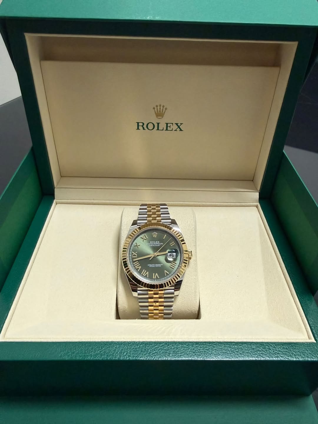 May be an image of wrist watch and text