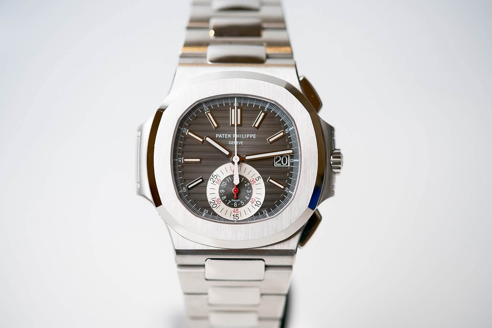 May be an image of wrist watch and text