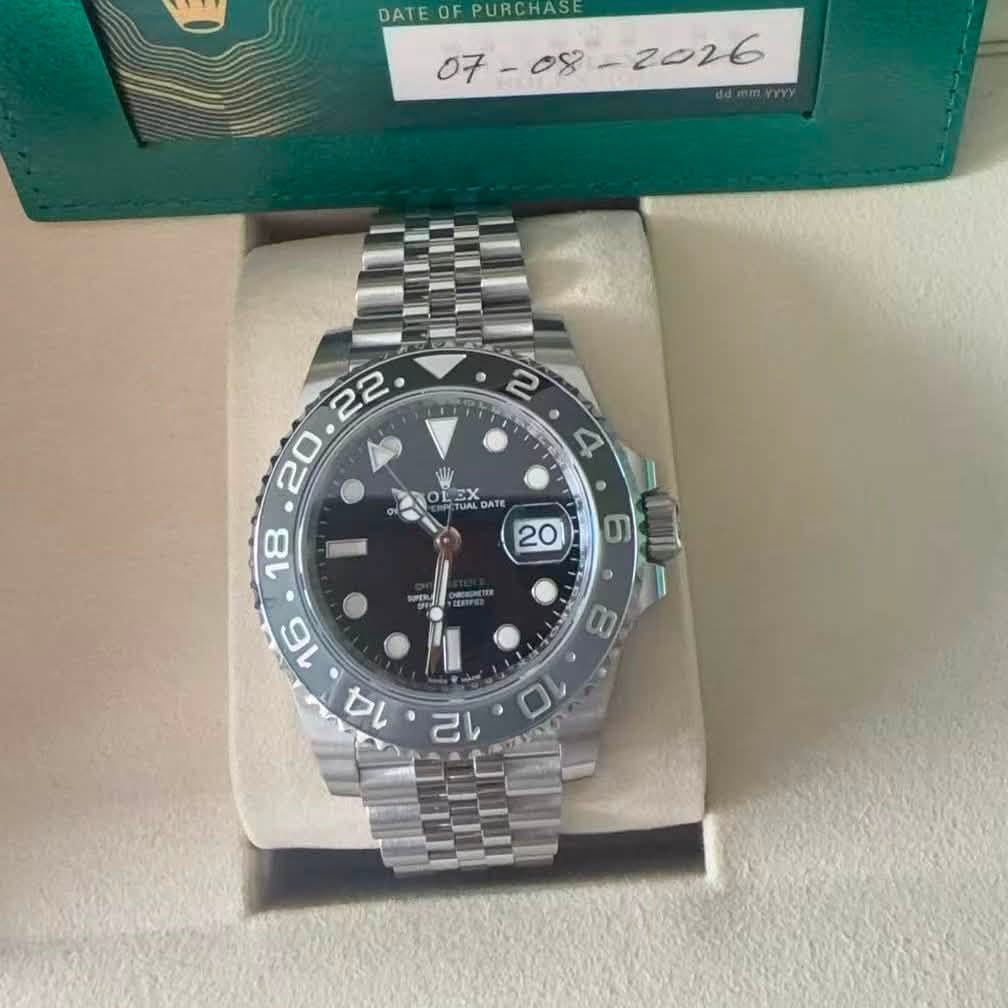 May be an image of wrist watch and text that says 'DATE 0 DATEOFPURCHASE FPURCHASE • LEX QATE ATE 18 20 6 NPTS CRES '