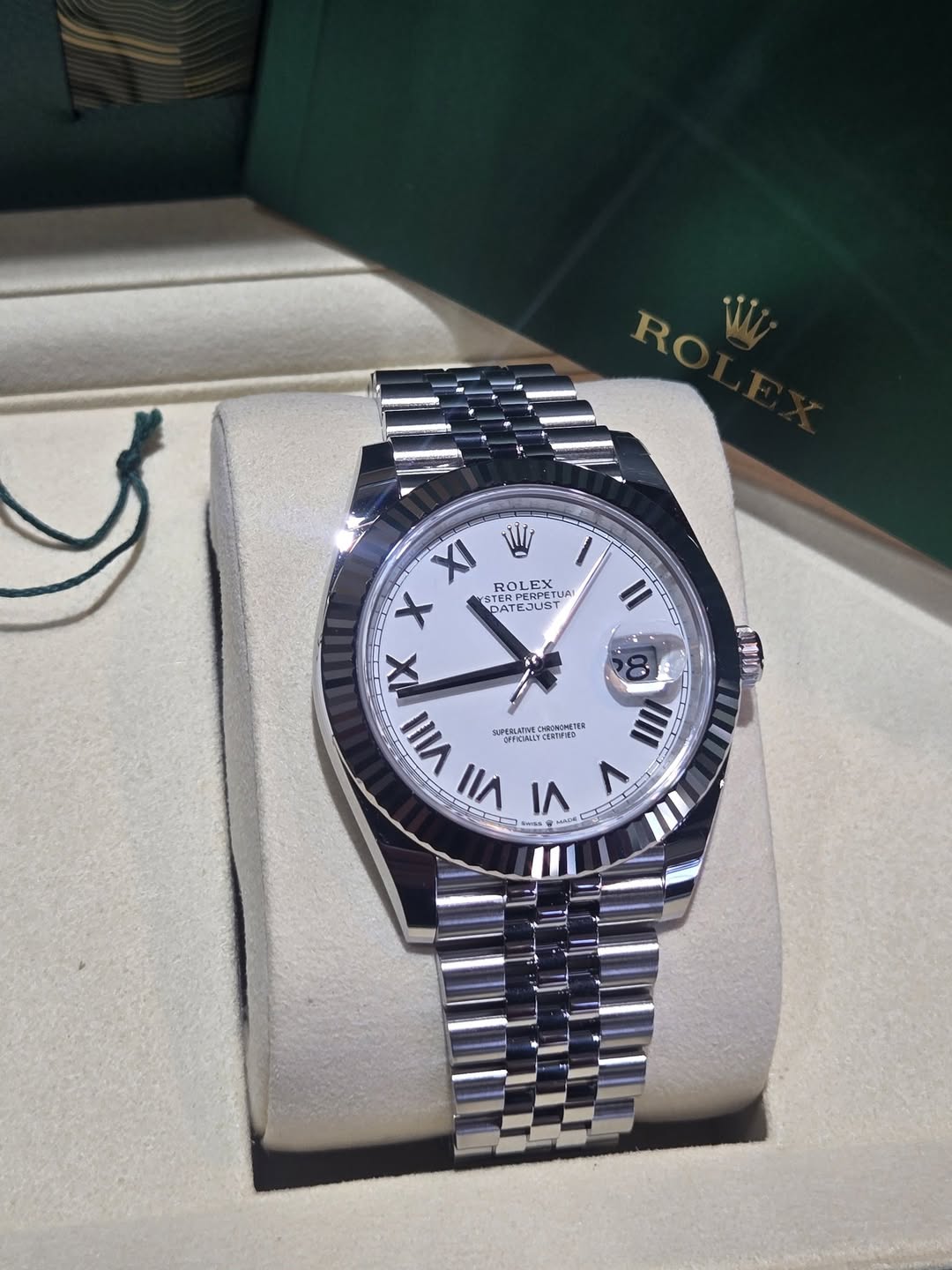 May be an image of wrist watch and text
