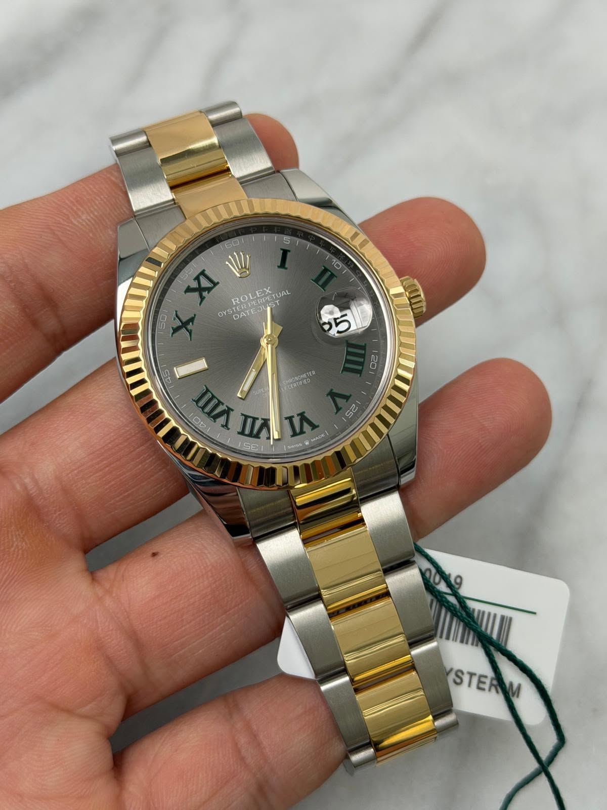 May be an image of wrist watch and text