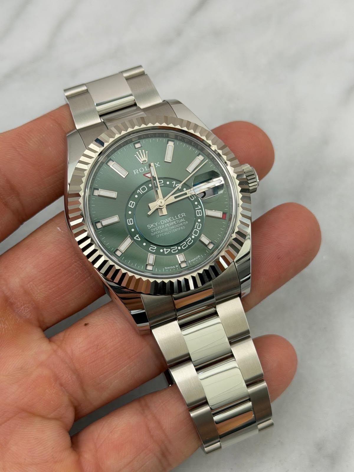 May be an image of wrist watch and text