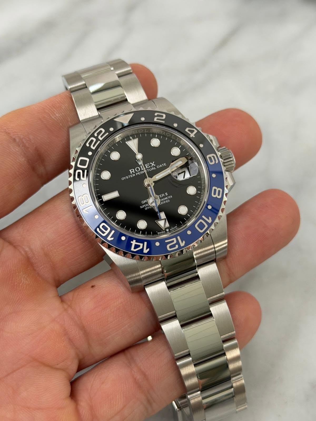 May be an image of wrist watch and text
