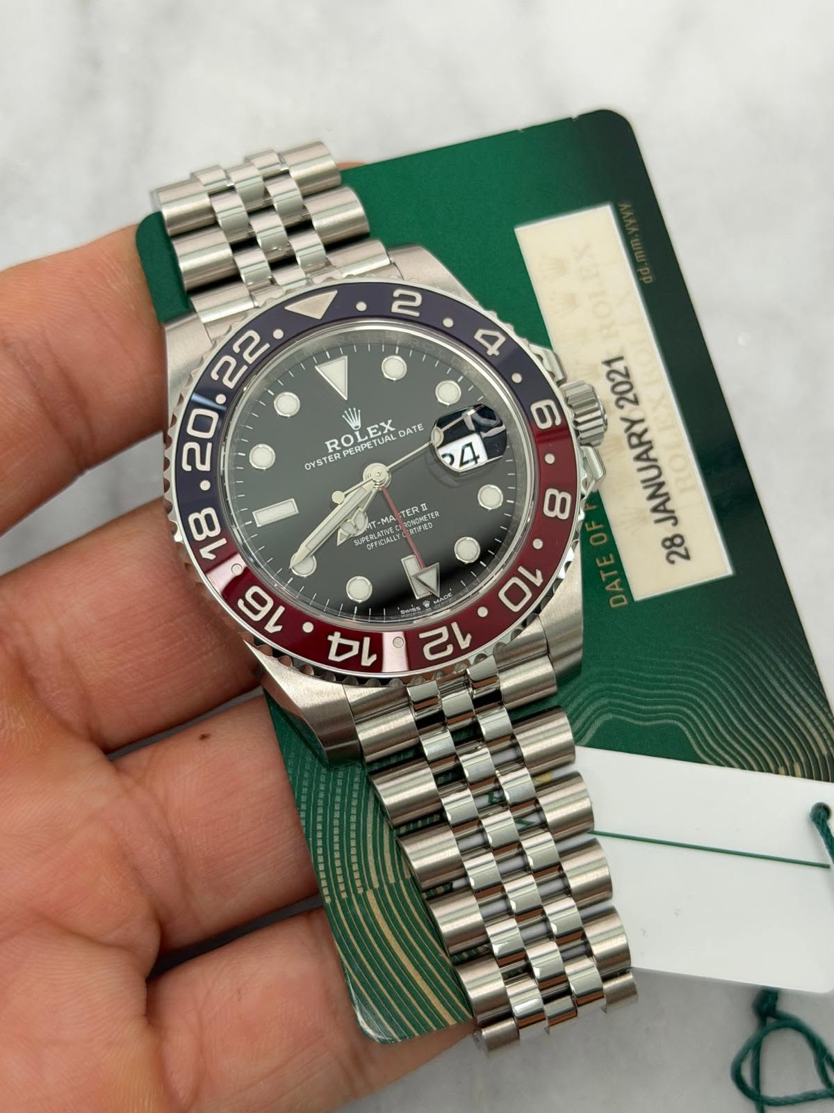 May be an image of wrist watch and text