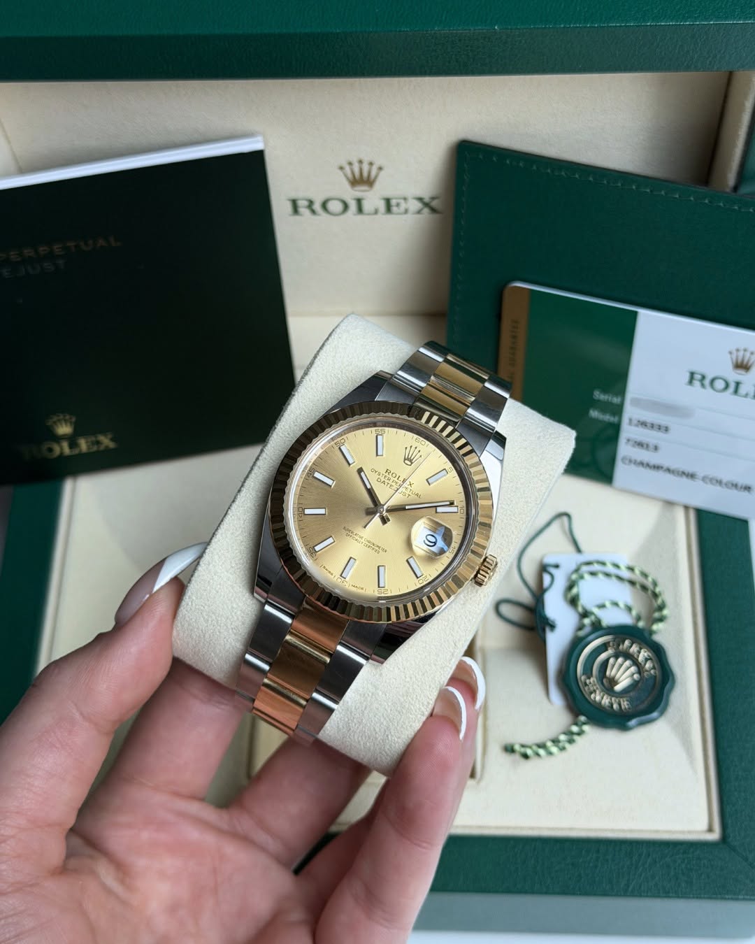 May be an image of wrist watch and text