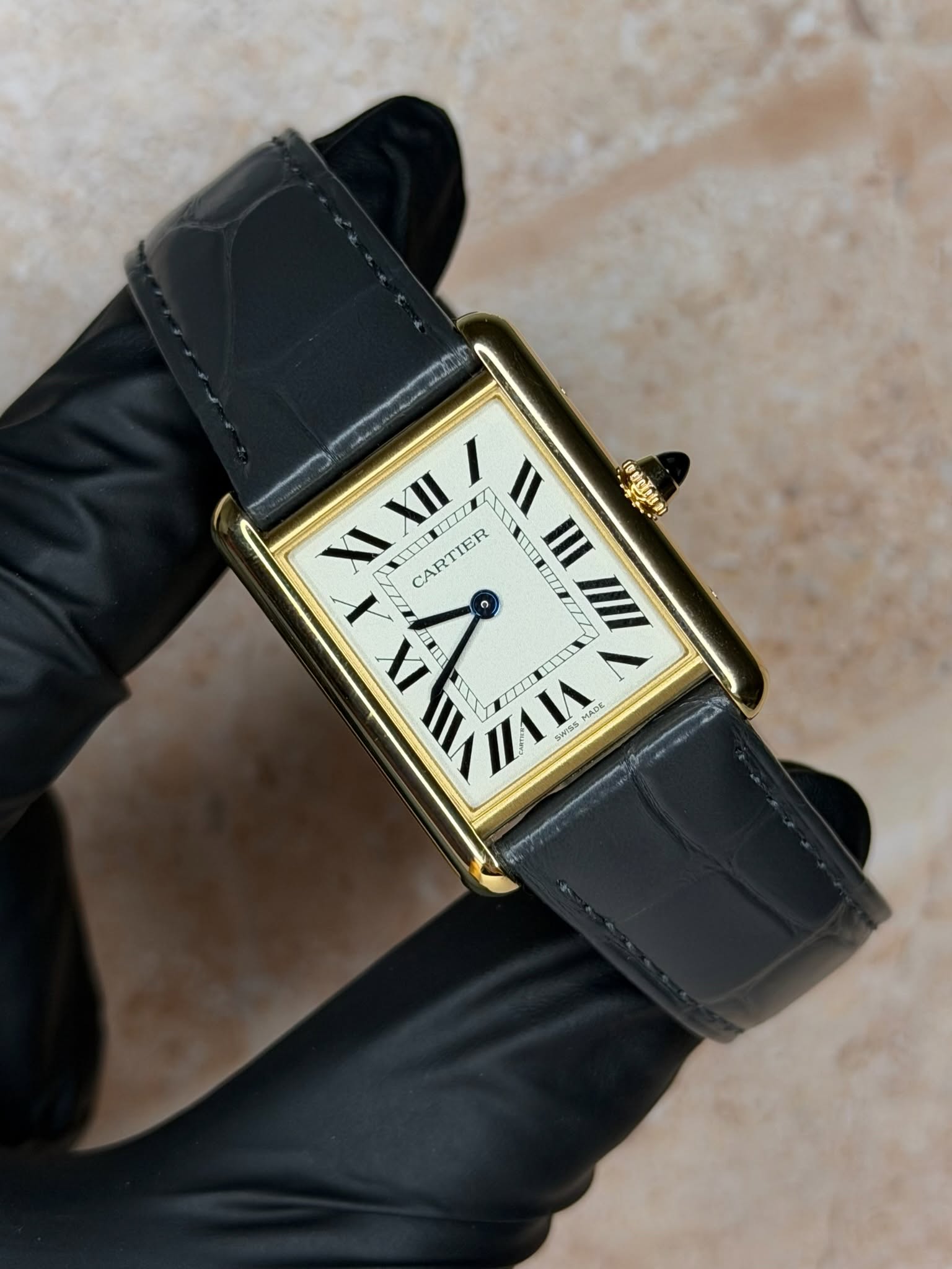 May be an image of wrist watch and text