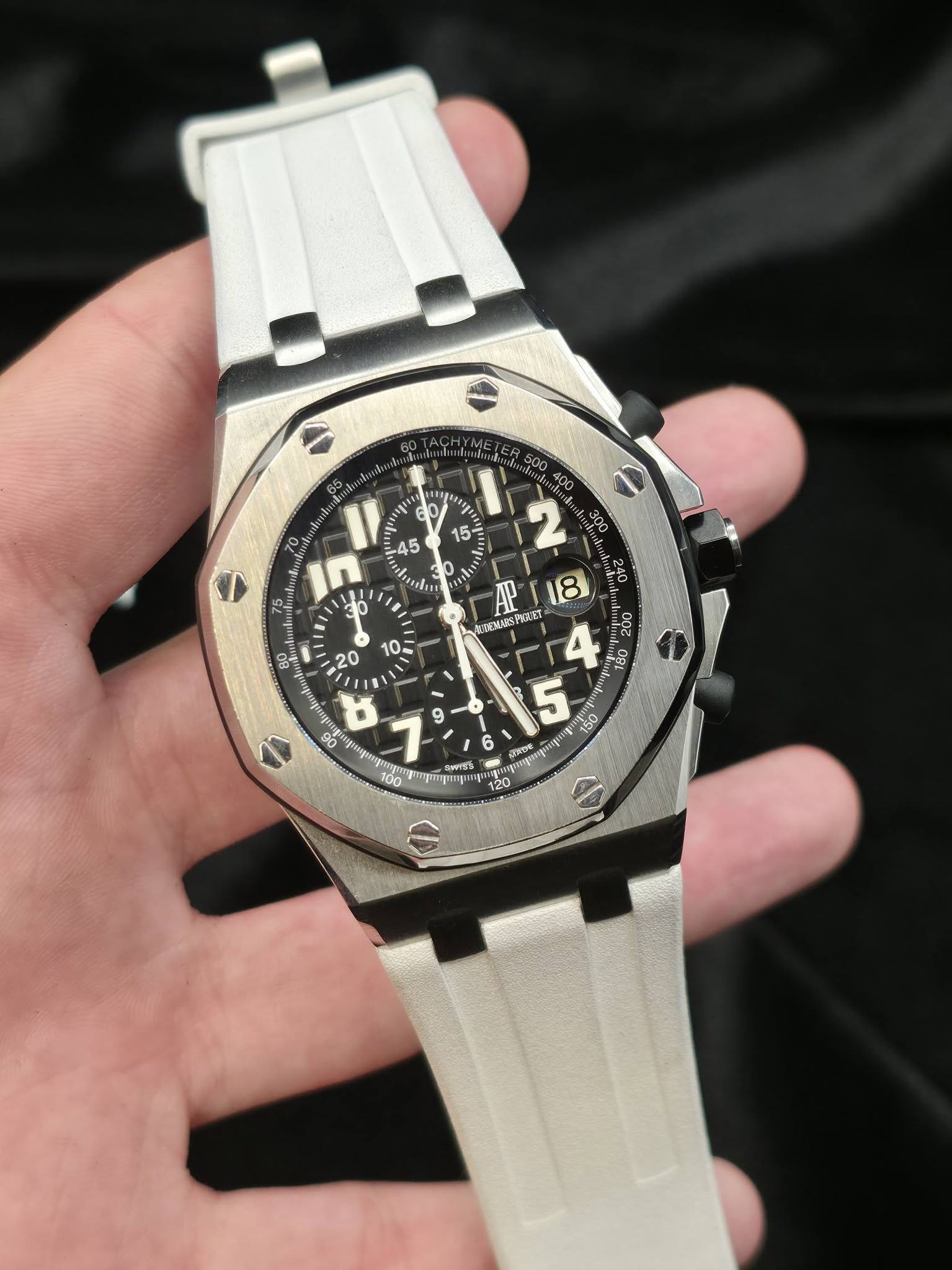 May be an image of wrist watch and text