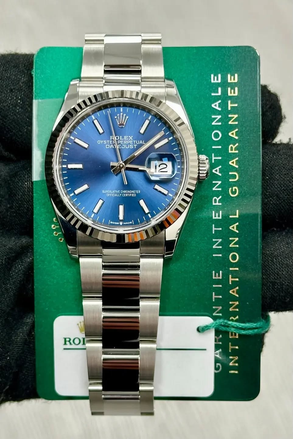 May be an image of wrist watch and text