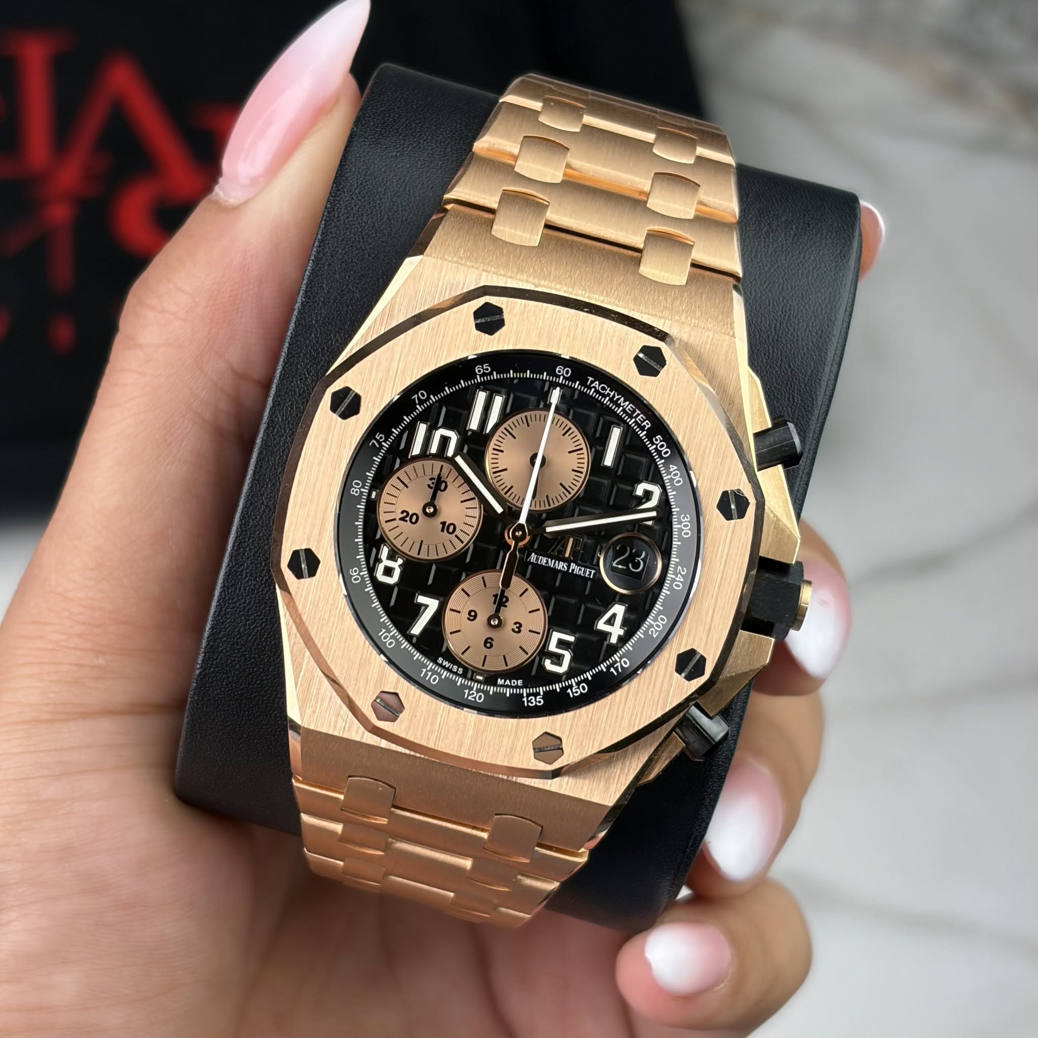 May be an image of wrist watch and text