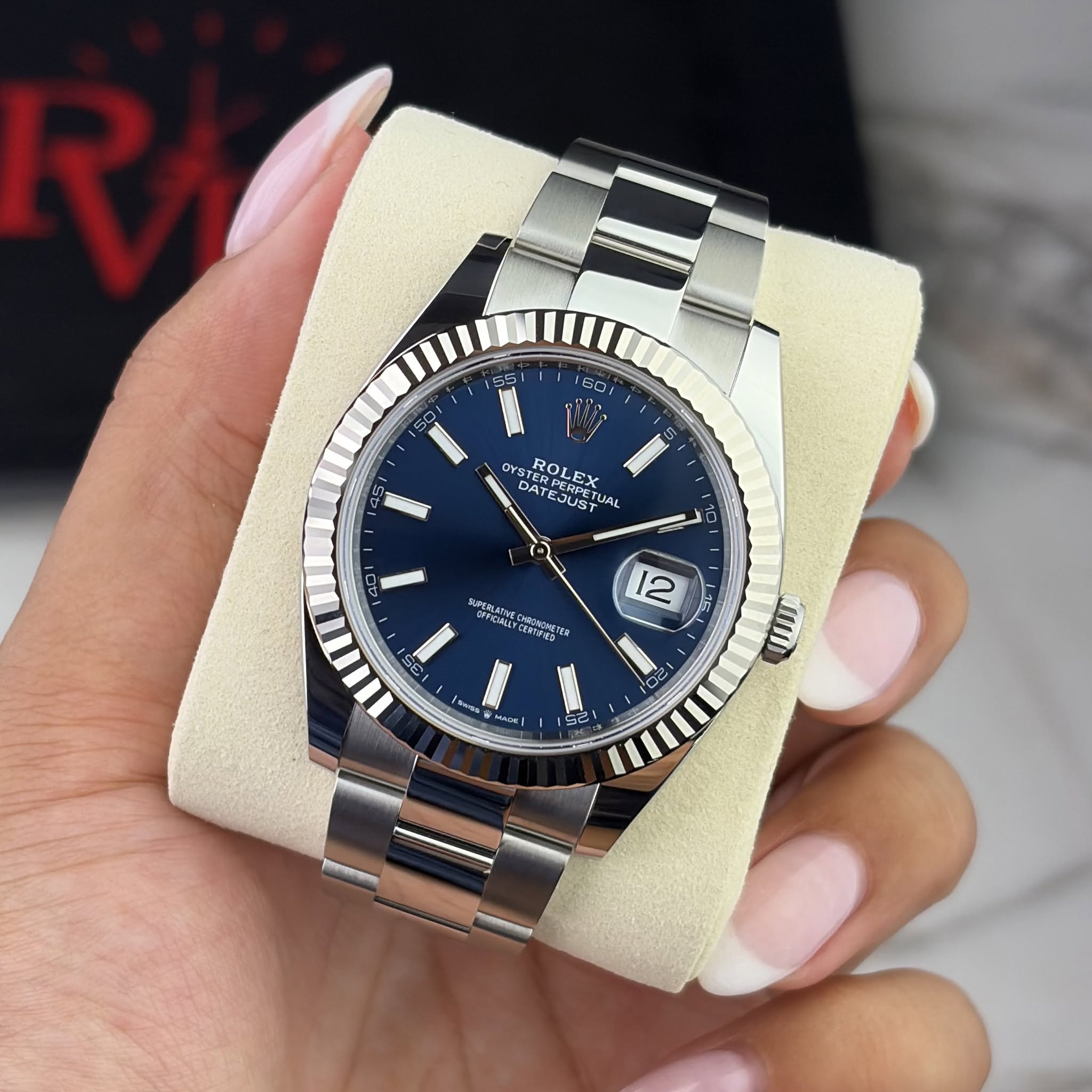 May be an image of wrist watch and text