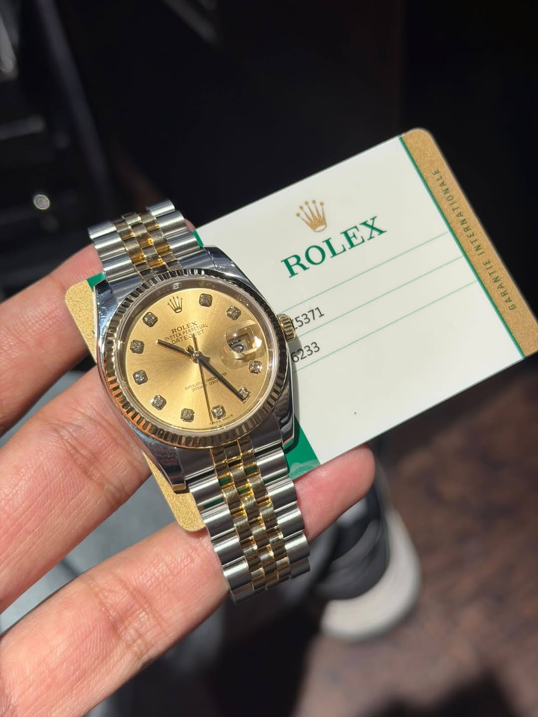 May be an image of wrist watch and text