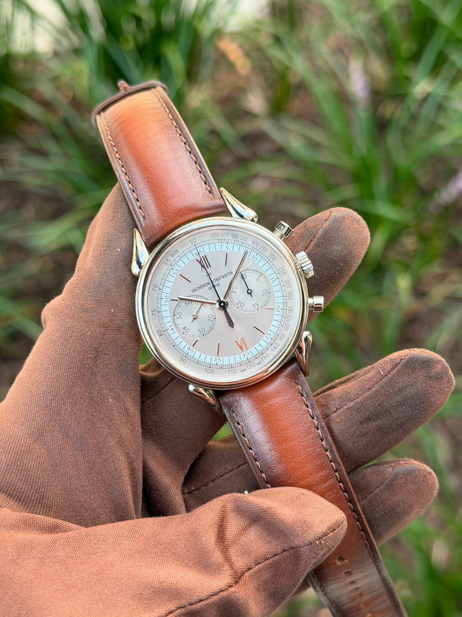 May be an image of leather, wrist watch and text