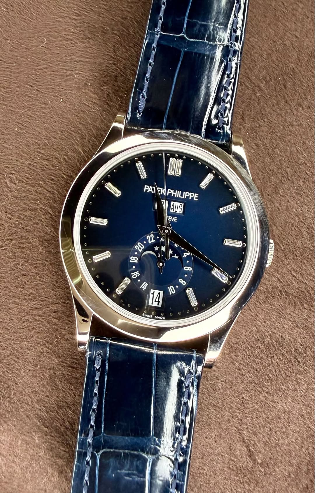 May be an image of wrist watch and text
