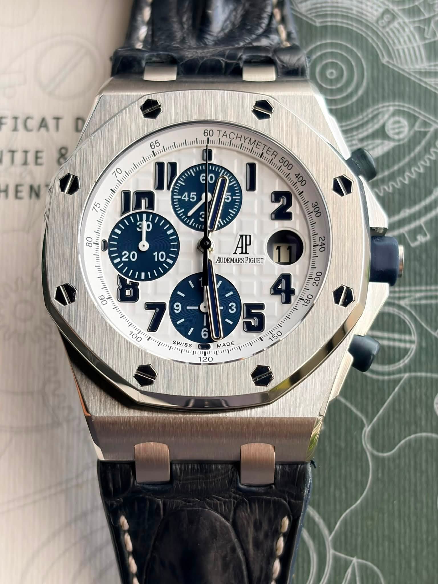 May be an image of wrist watch and text