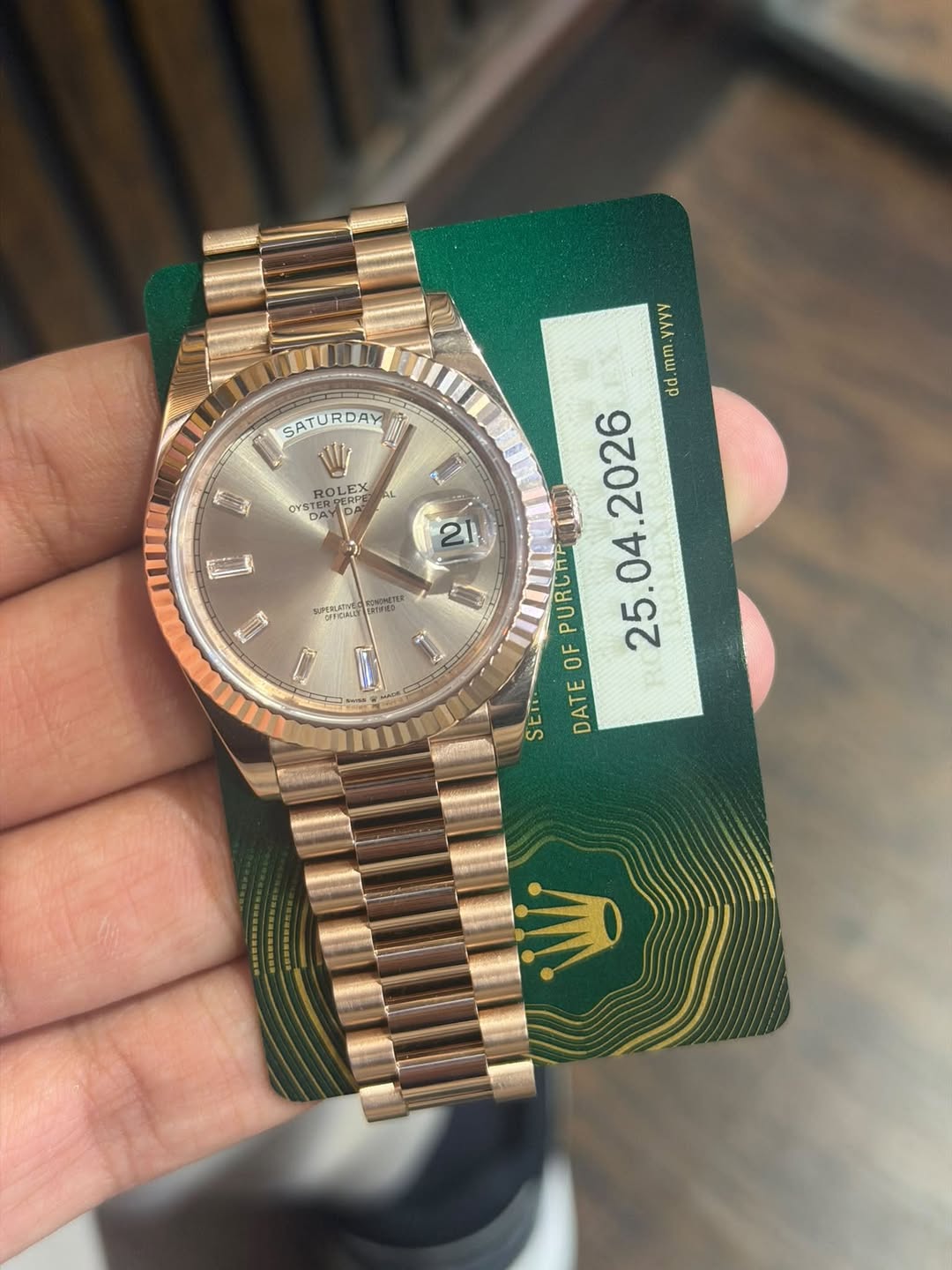 May be an image of wrist watch and text