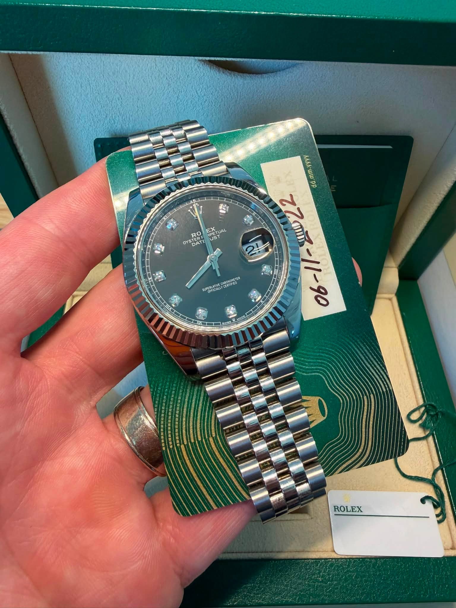 May be an image of wrist watch and text