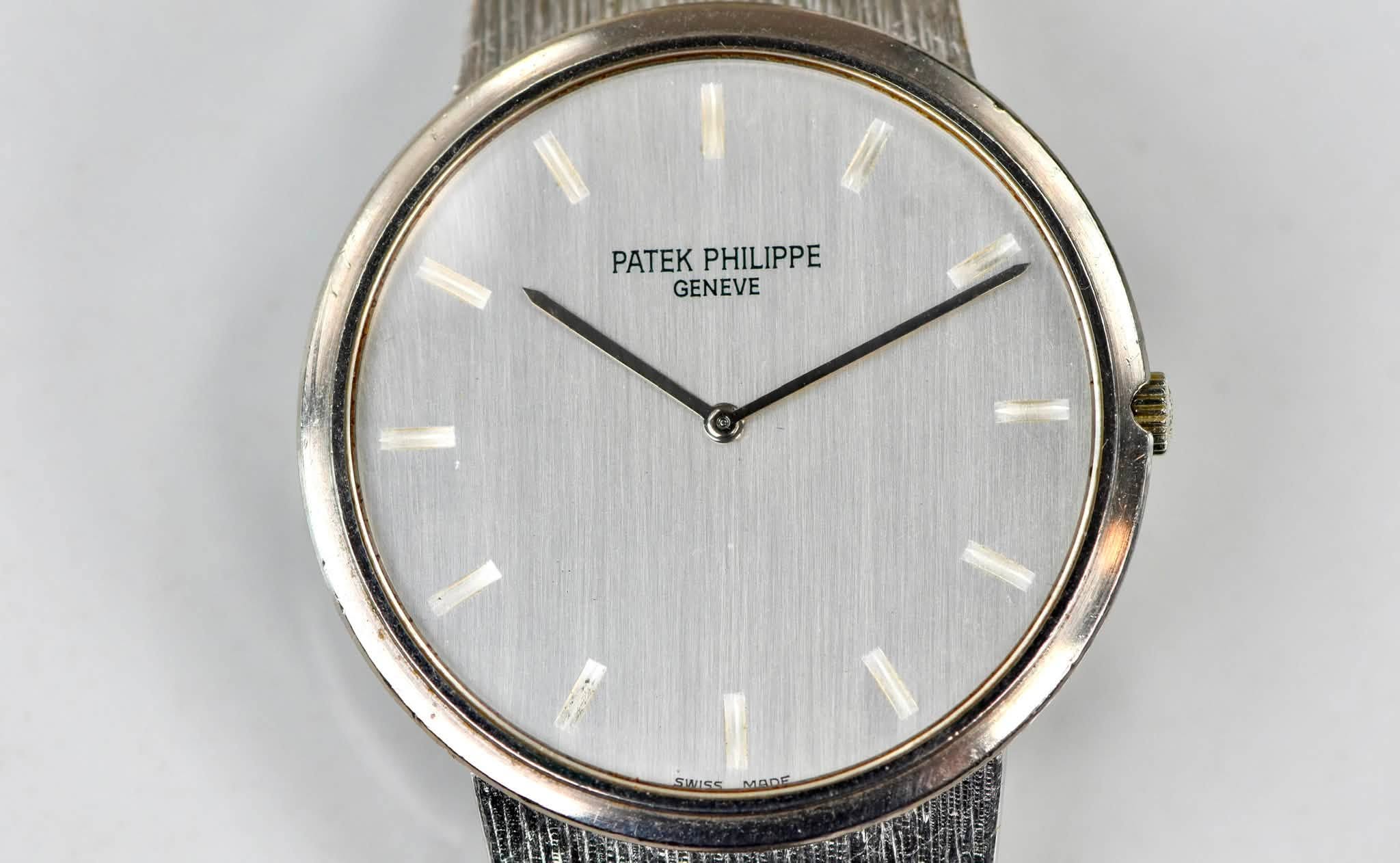 May be an image of wrist watch and text that says 'PATEK ATEKPHILIPPE PHILIPPE GENEVE SWSS MADE'