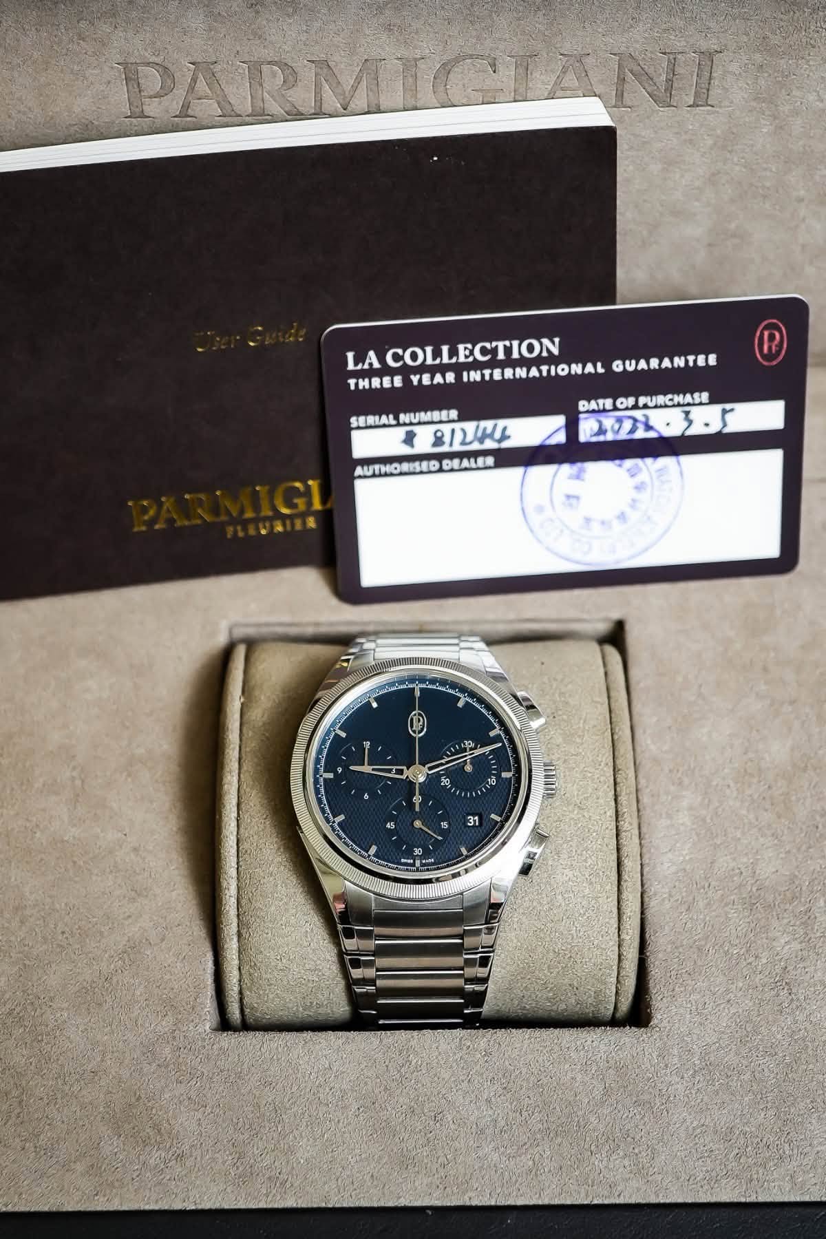May be an image of wrist watch and text that says 'PARMIGIANI LA COLLECTION THREE YEAR INTERNATIONAL GUARANTEE DATE OF PURCHASE 201.3-5 የሞኒ፡ 3.5 SERIAL SERIALNUMBER NUMBER 2…