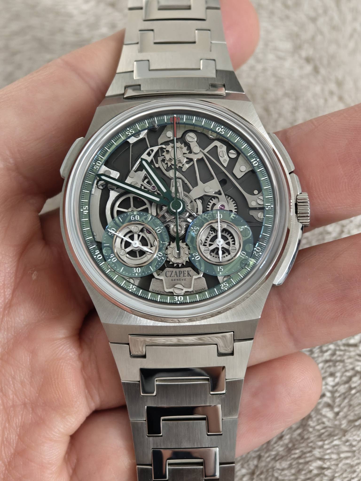 May be an image of wrist watch and text
