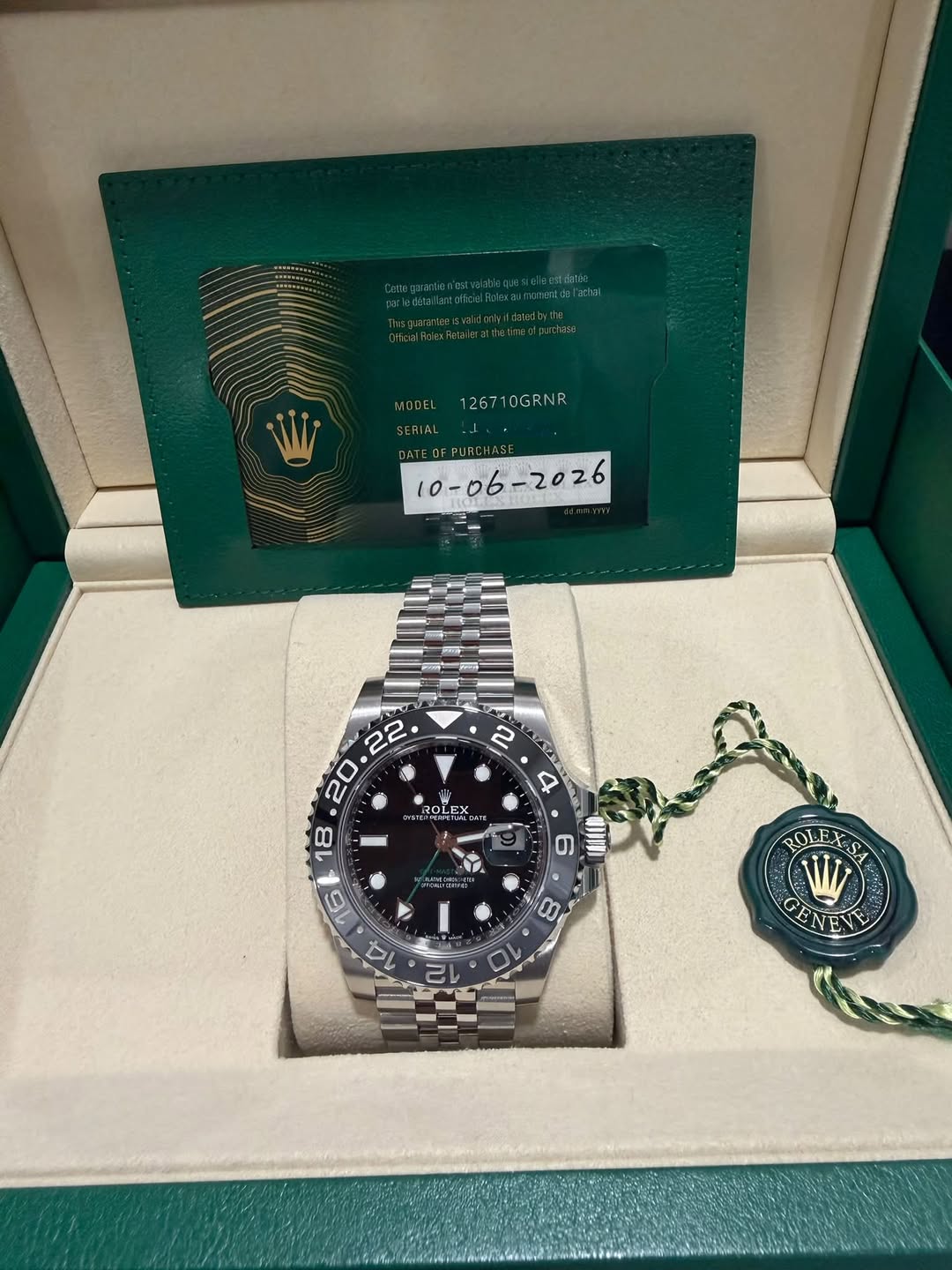 May be an image of wrist watch and text that says 'MODEL 126710GRNR 0DEL126710GRNR 10GRNR SERIAL DEPURCHAS A ROLE LEX M 6 O 10 2 WV GEN GEN'