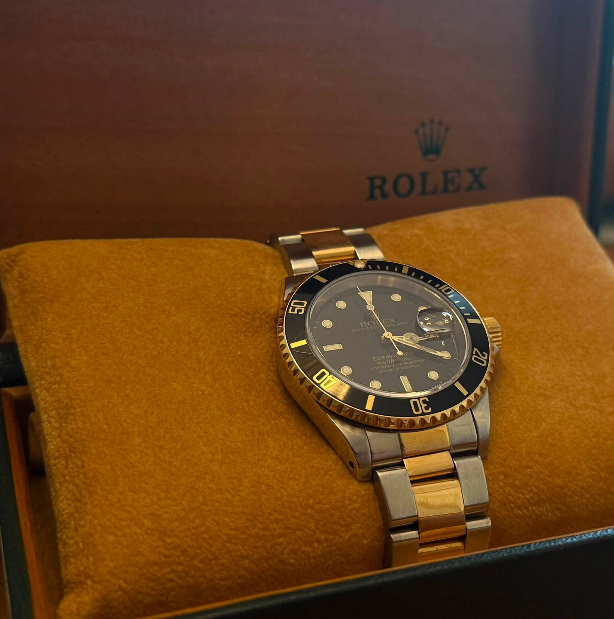 May be an image of wrist watch and text