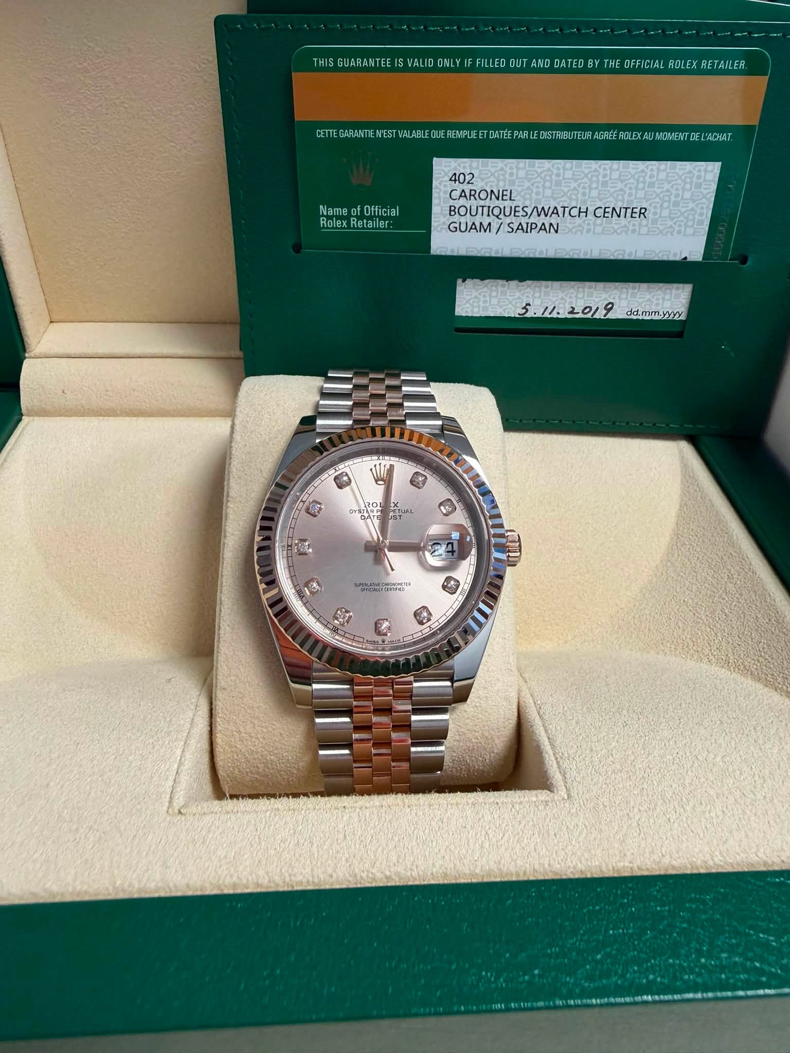 May be an image of wrist watch and text