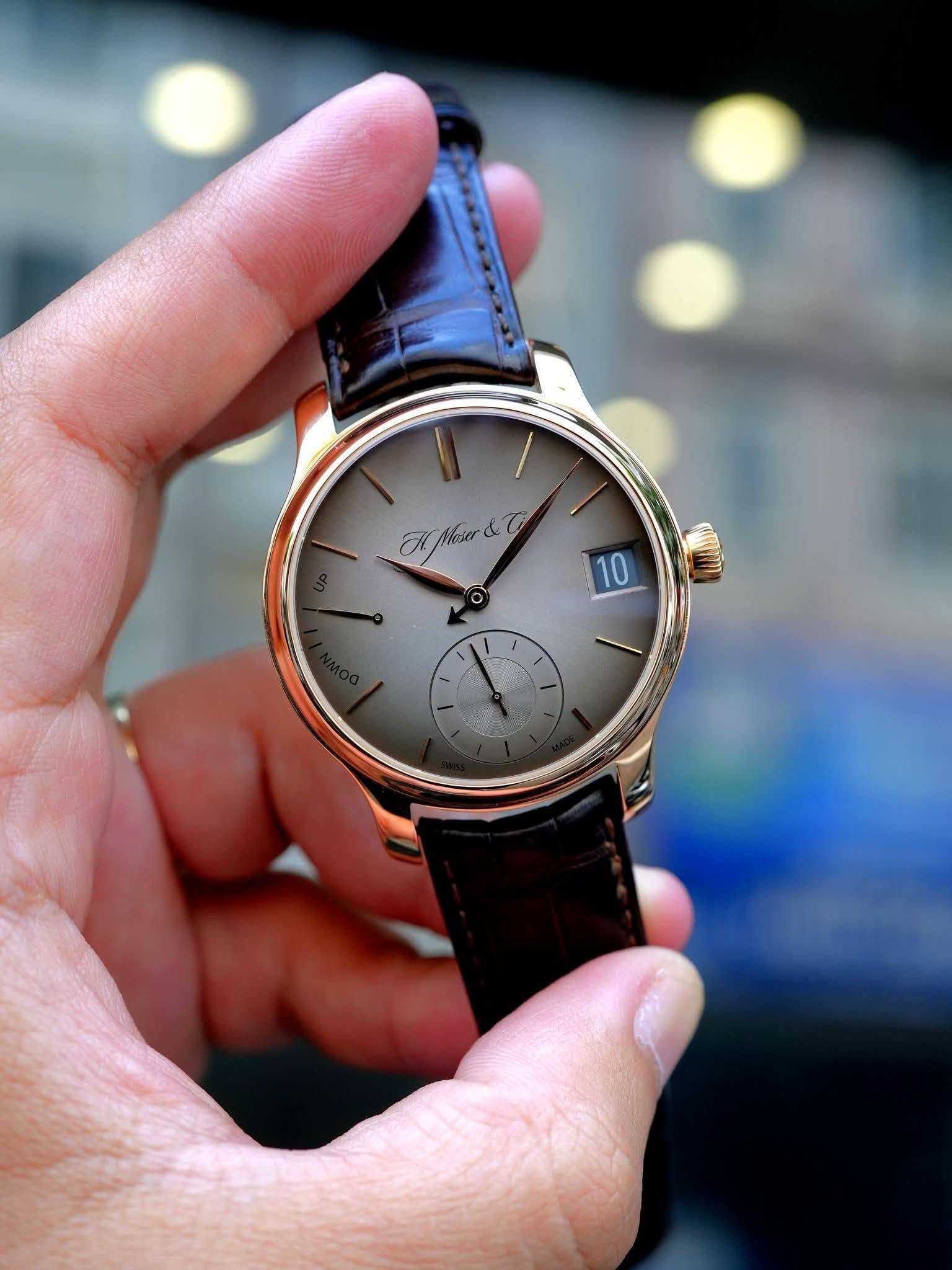 May be an image of wrist watch and text