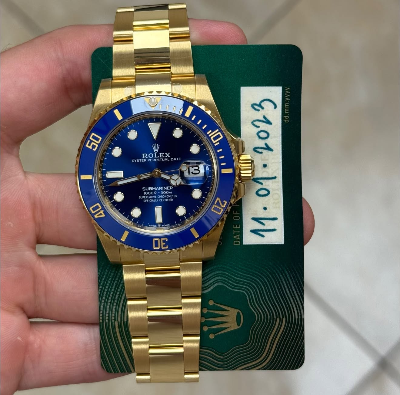 May be an image of wrist watch and text