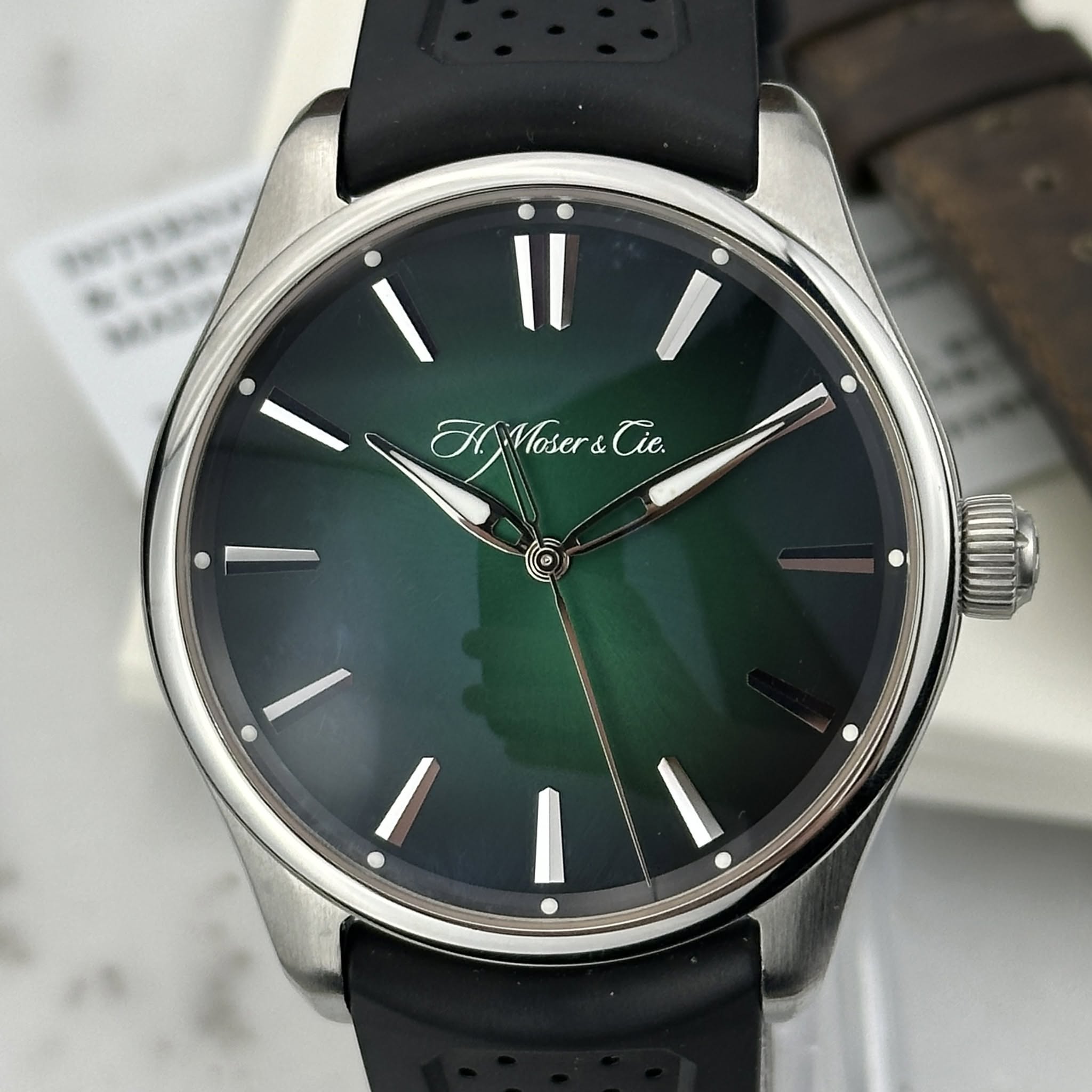 May be an image of wrist watch and text that says 'ii I AMoser&Cie Tie. bcb ie.'
