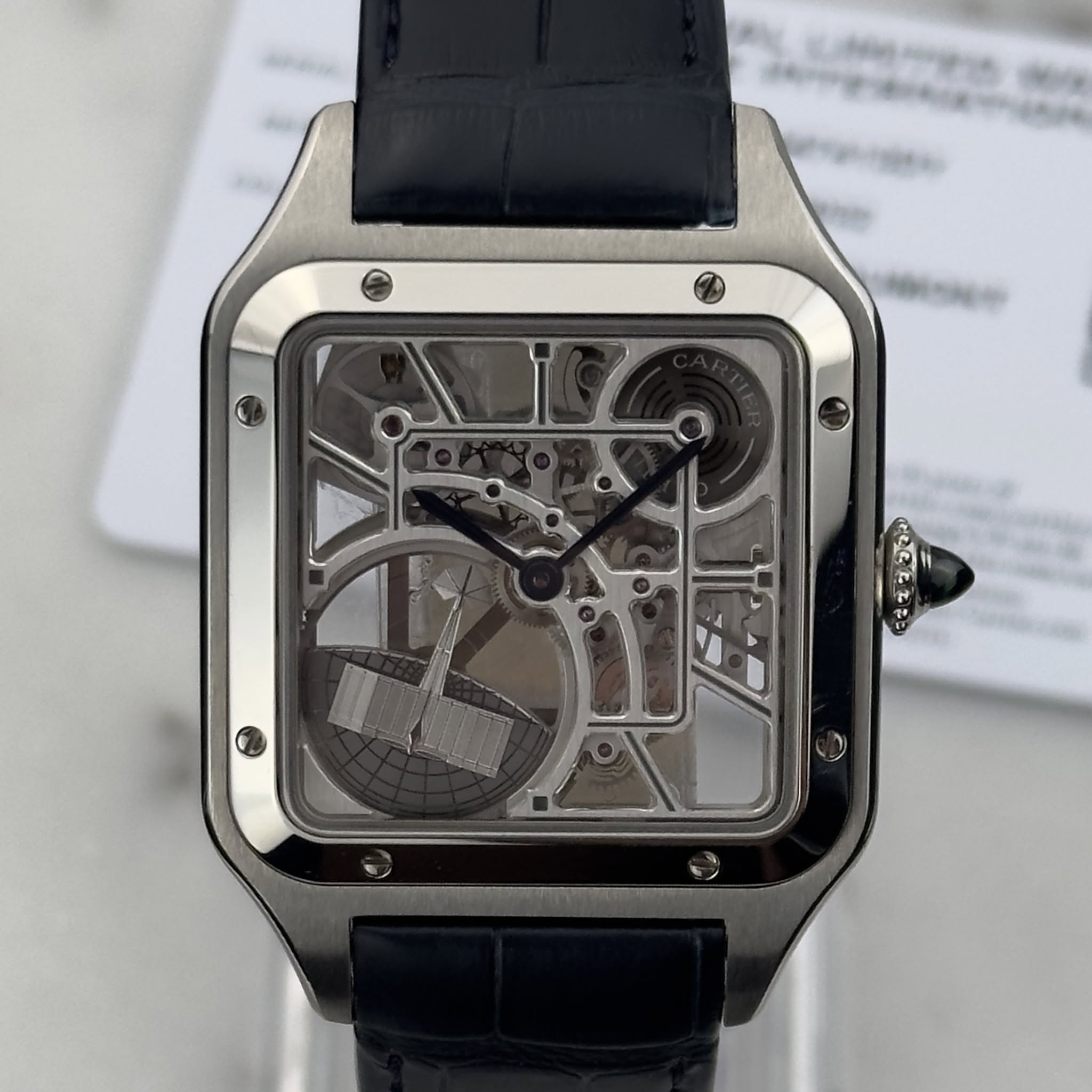May be an image of wrist watch and text