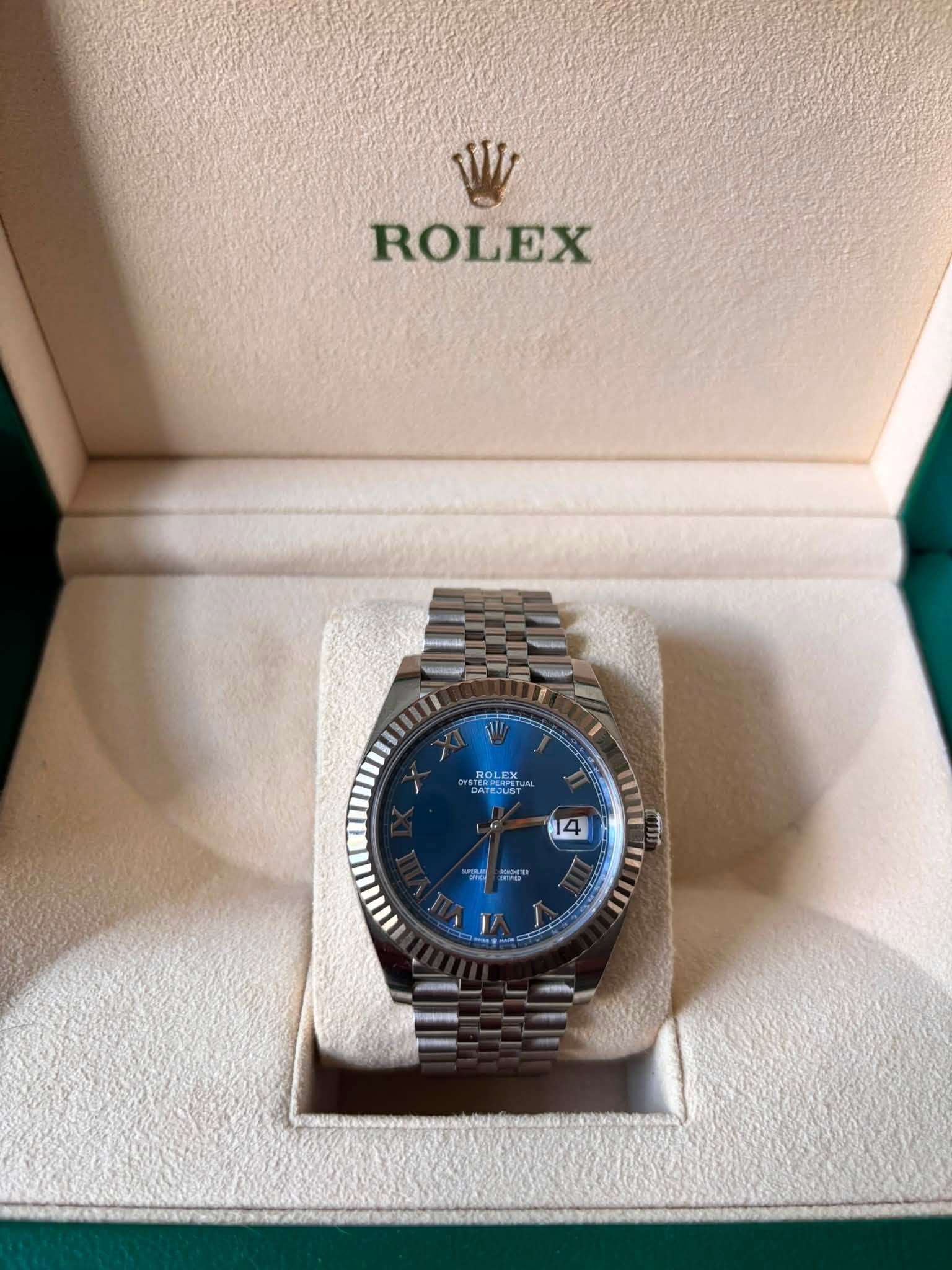 May be an image of wrist watch and text that says 'ROLEX ROLEX DATEJUS RAN Sy 14 απή お II'