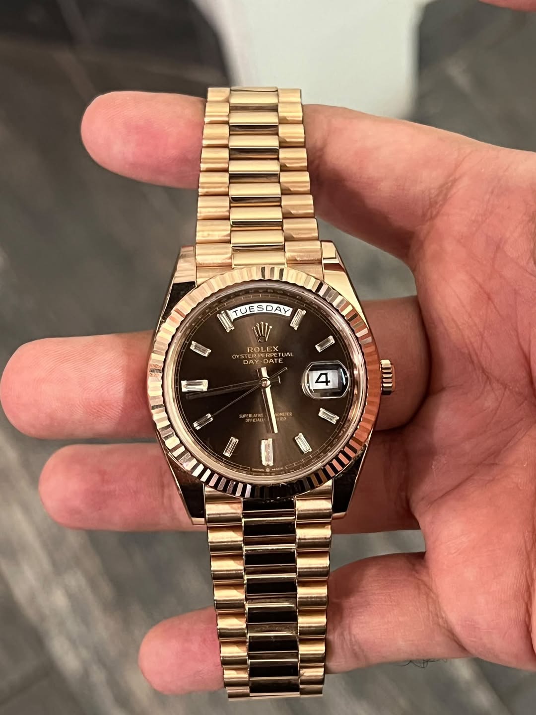 May be an image of wrist watch and text